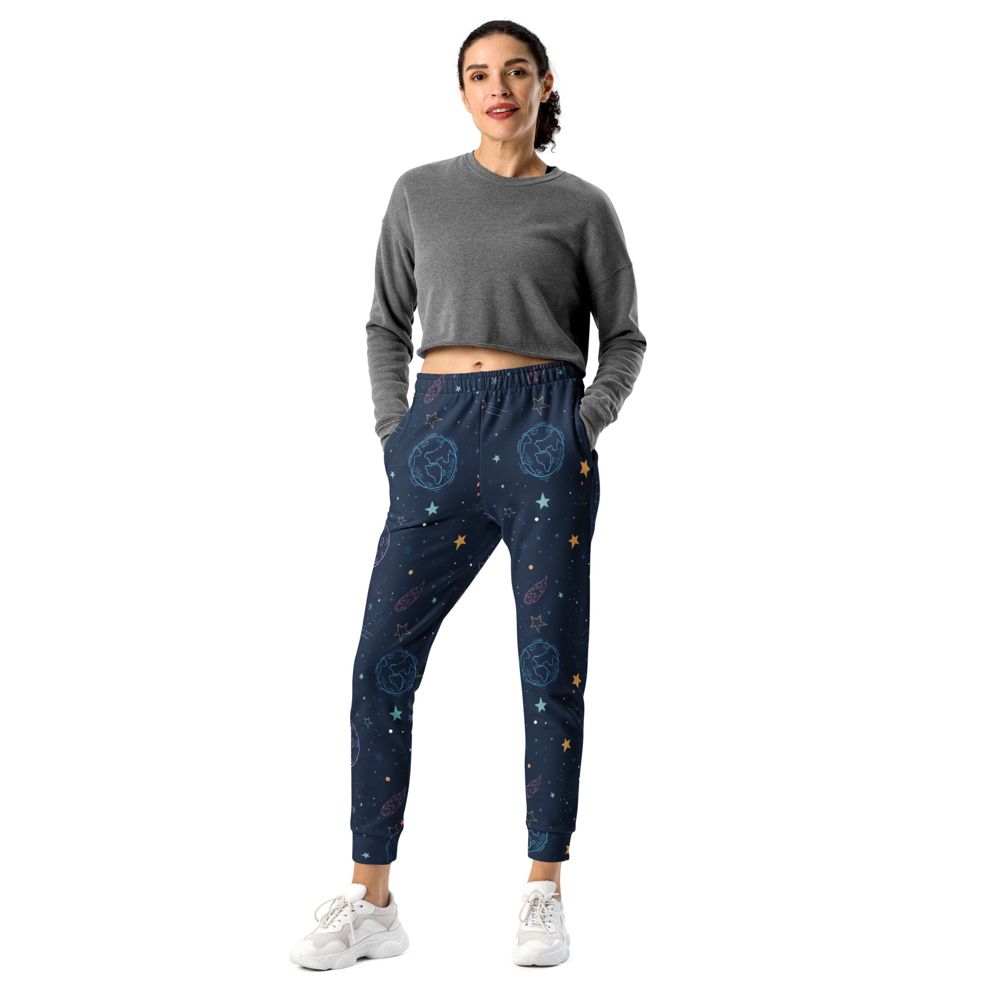 Dark blue women’s jogger pants with cosmic print of glowing planets stars and constellations cozy fleece lining
