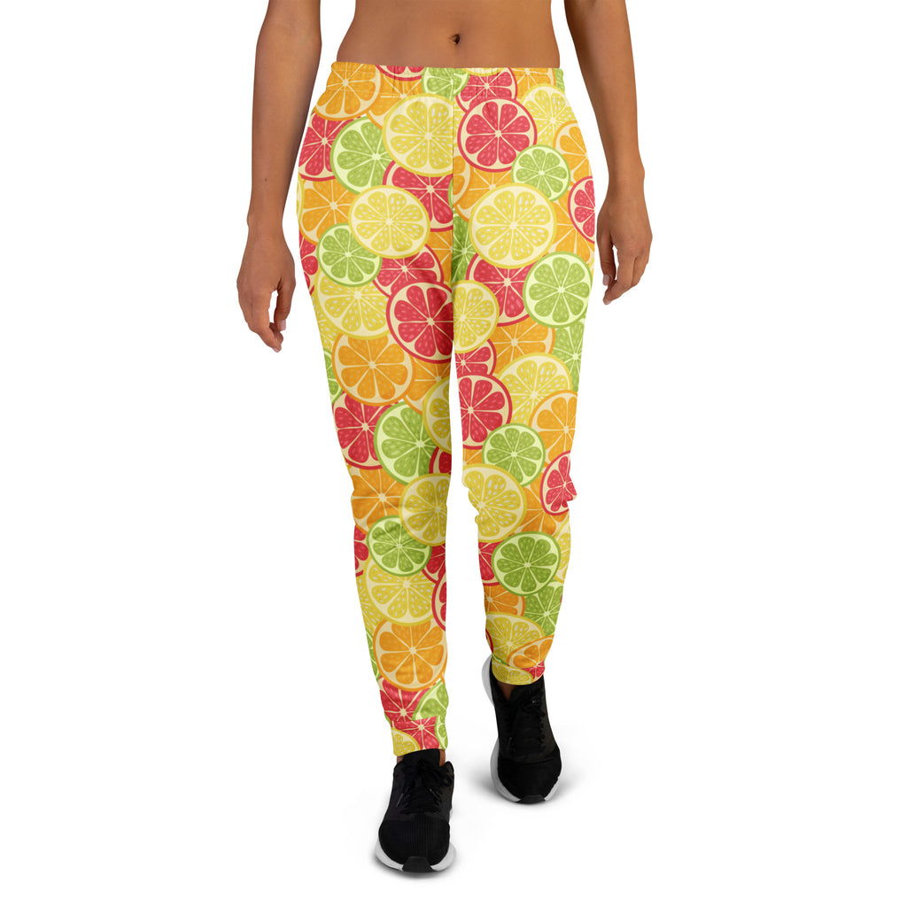 Women’s citrus slice recycled jogger pants with pockets featuring a vibrant lemon lime and grapefruit pattern on yellow