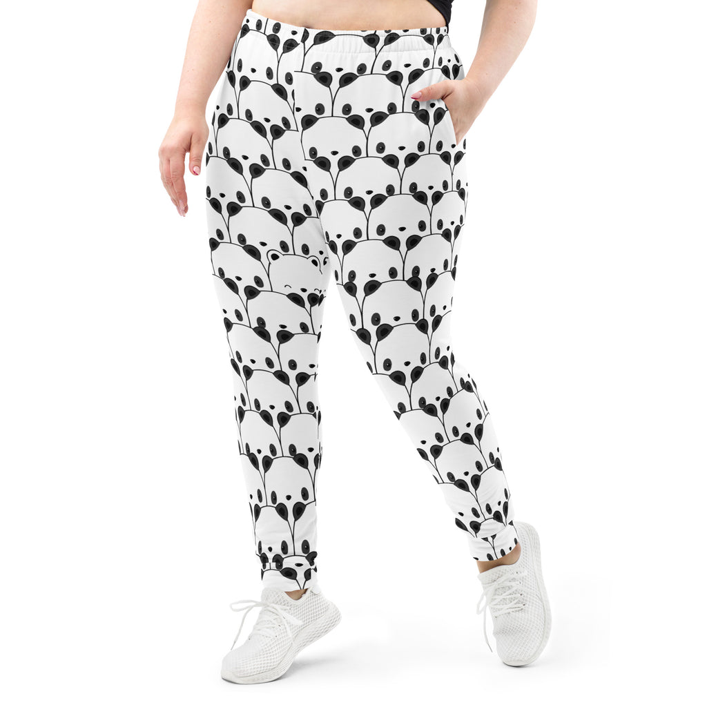 White women’s jogger pants with black panda face pattern and leafy vines cozy brushed inside fleece pockets