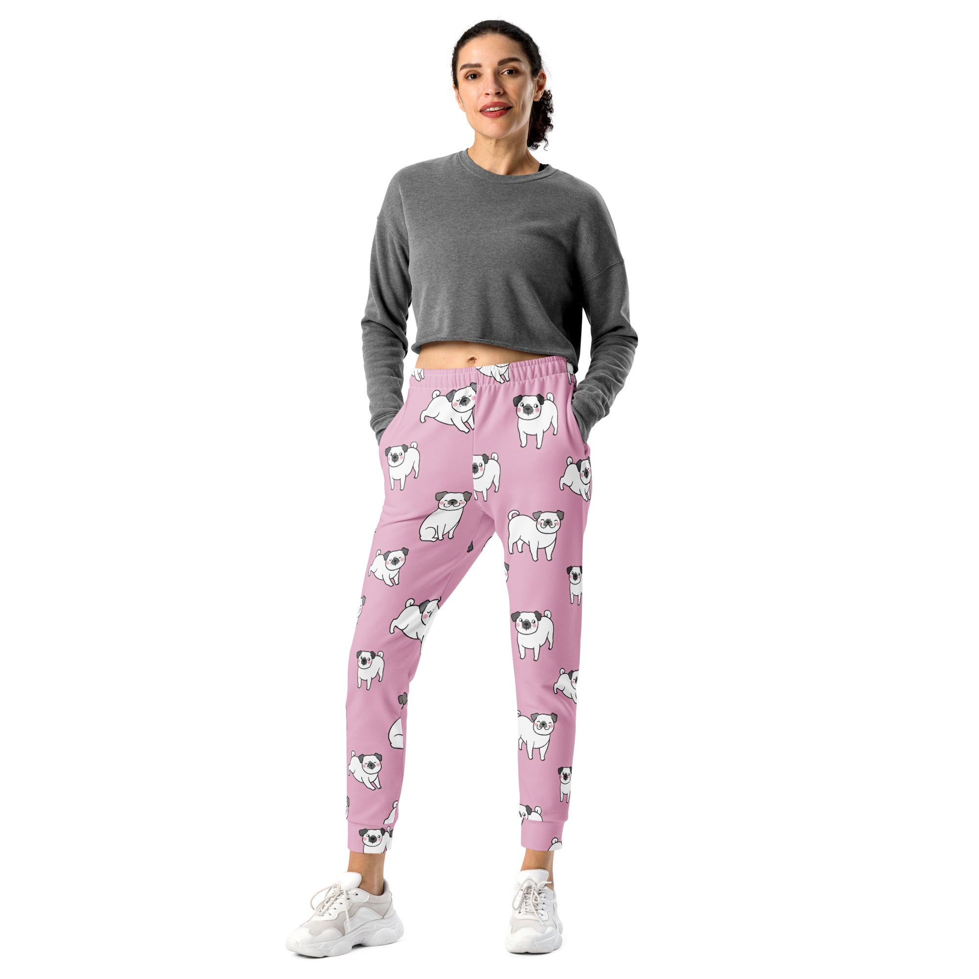 Women’s pink pug recycled jogger pants with pockets feature playful white pug illustrations and cozy brushed fleece lining
