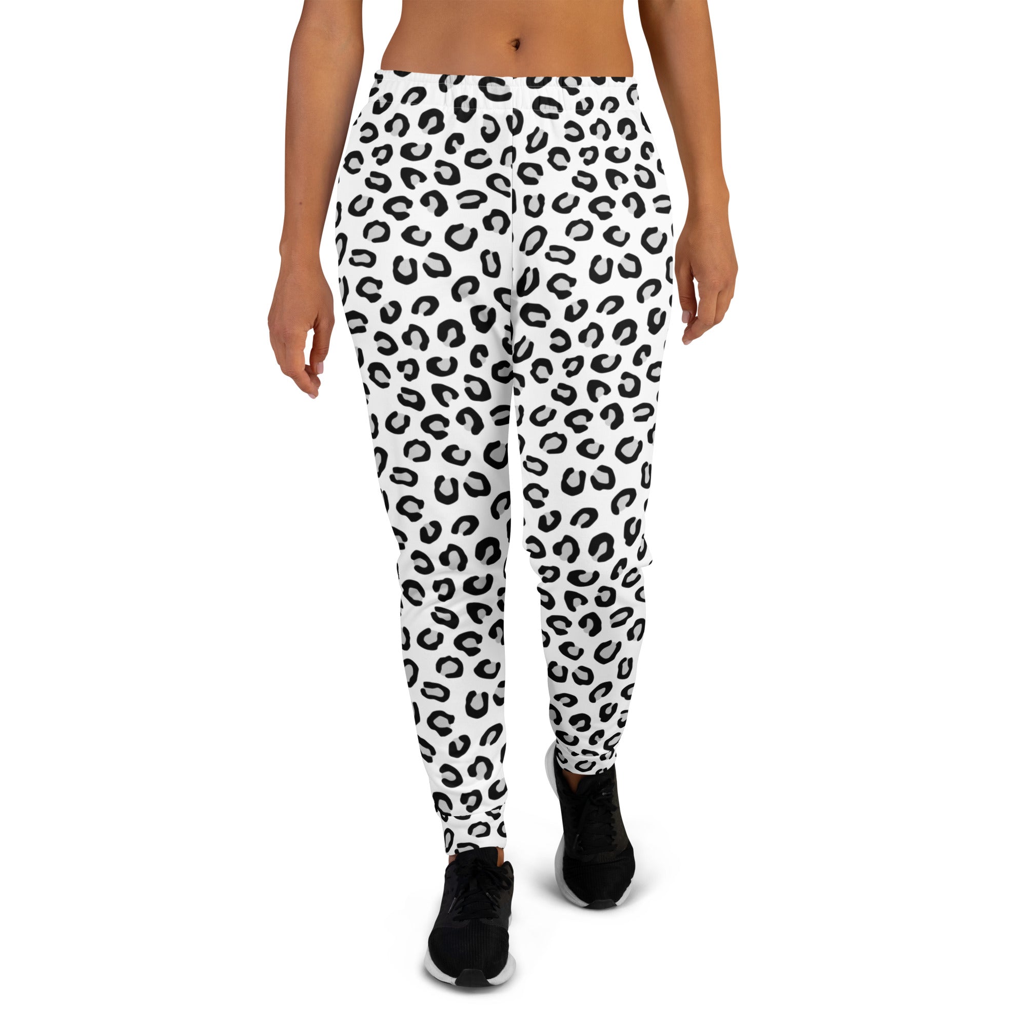White leggings with bold black leopard print featuring cozy brushed inside fleece and pockets for casual wear