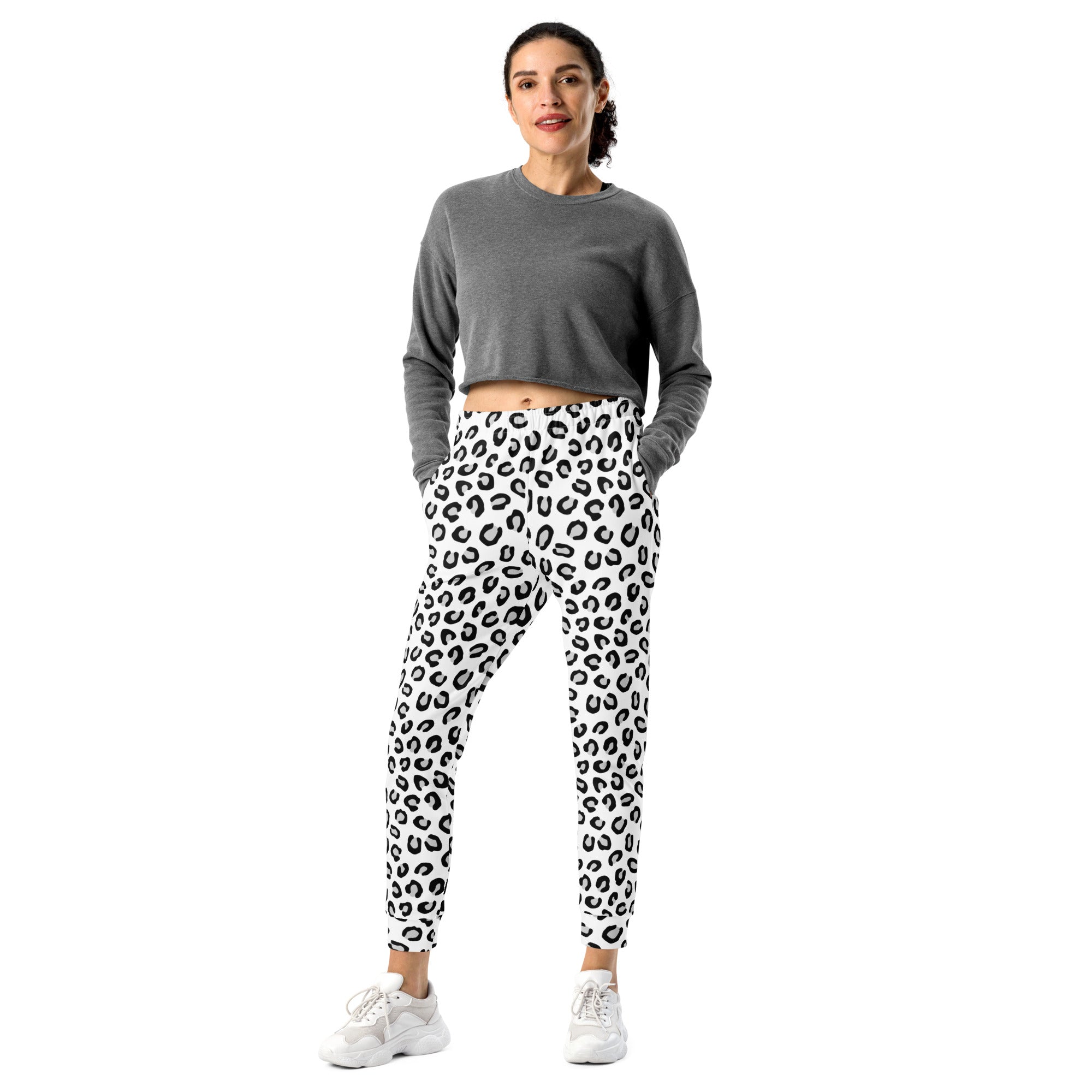 White joggers with black leopard print pattern made of recycled cozy brushed inside fleece with pockets for women