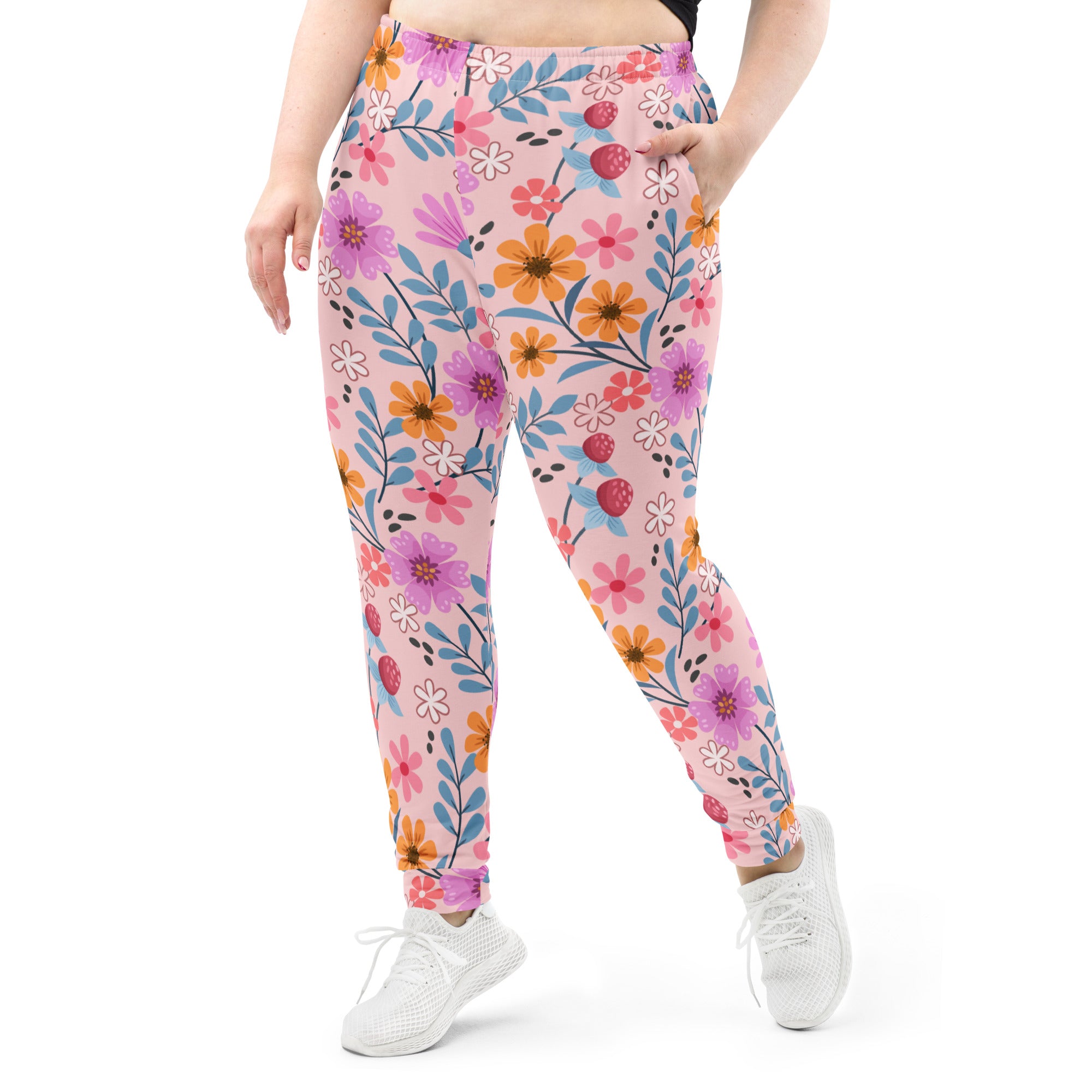 Women’s pink floral recycled jogger pants with vibrant flowers and strawberries on soft brushed fleece fabric with pockets