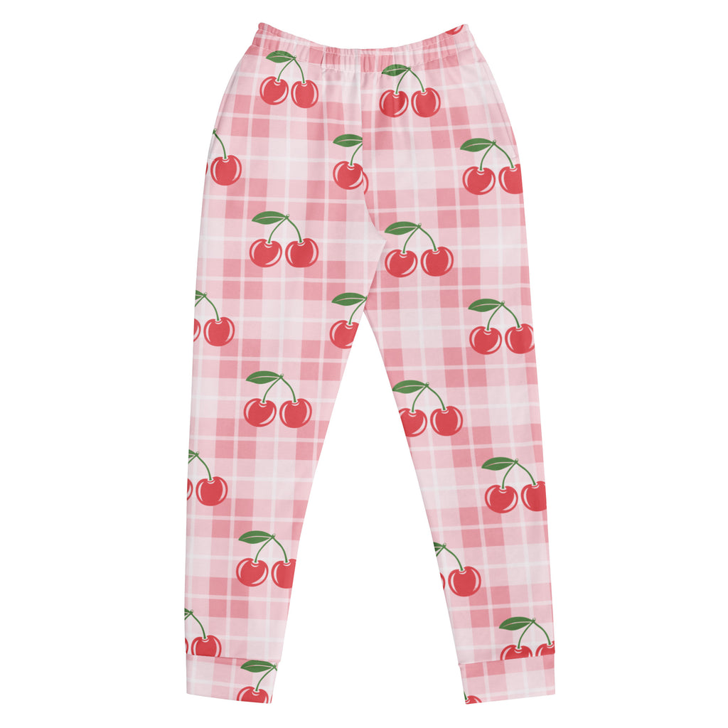 Women’s pink plaid jogger pants with red cherry pattern and green stems made from cozy brushed inside fleece