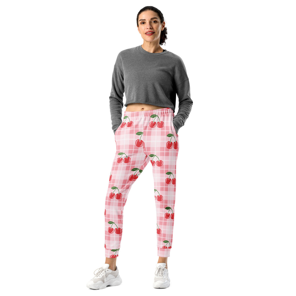 Women’s pink and white plaid jogger pants with playful cherry pattern cozy brushed inside fleece pockets