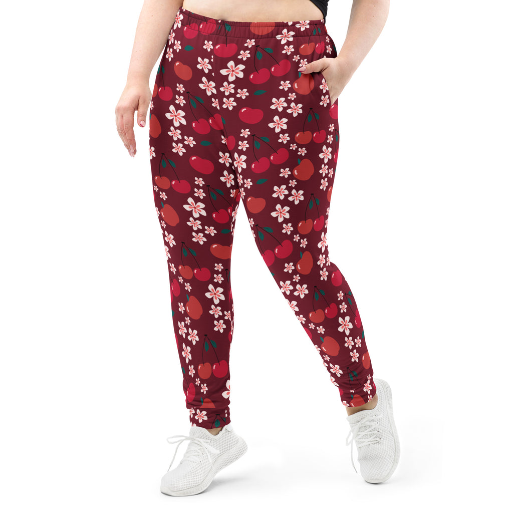 Women’s maroon cherry blossom jogger pants with red cherries pink blossoms cozy brushed fleece pockets