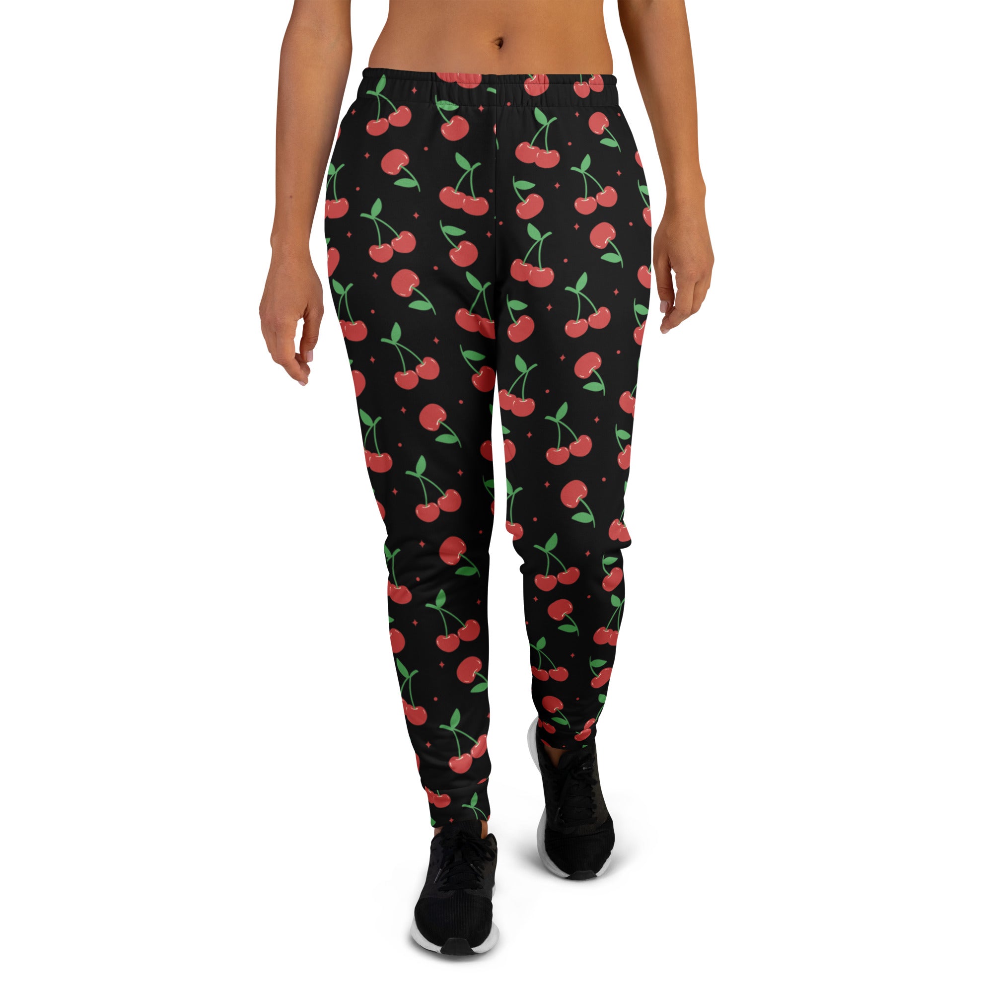Women’s black cherry recycled jogger pants with cozy brushed fleece inside featuring red cherry pattern and small stars