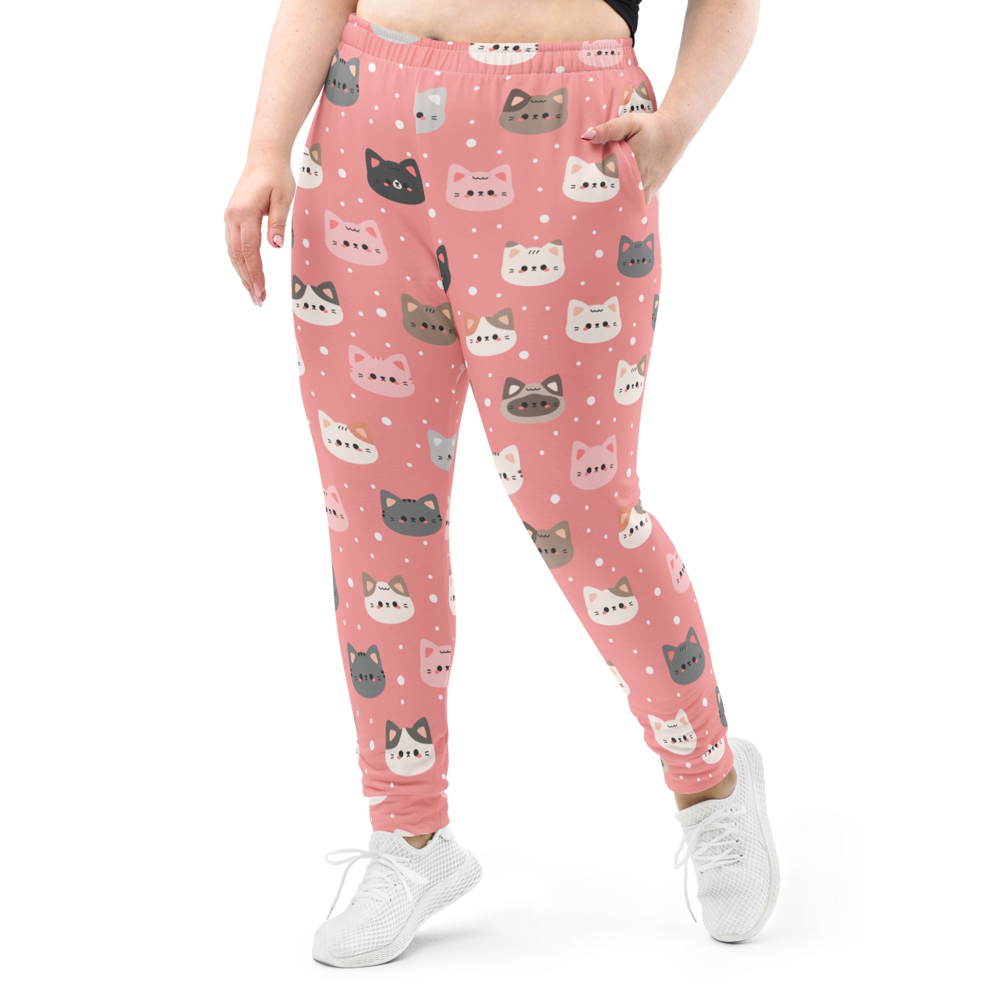 Women’s pink plus-size jogger pants with playful multicolored cat faces cozy brushed inside fleece with pockets
