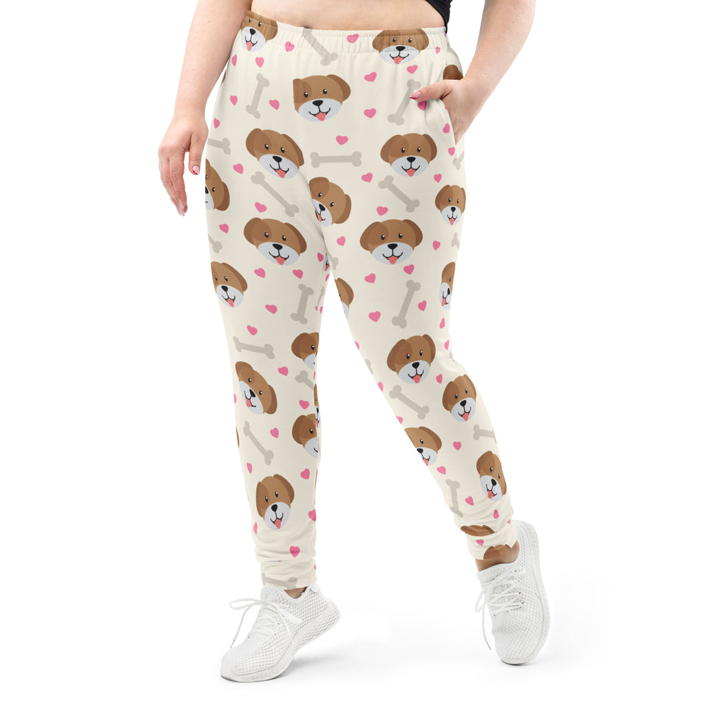 Women’s cream-colored plus-size recycled jogger pants with puppy face pink heart and gray bone print and fleece lining