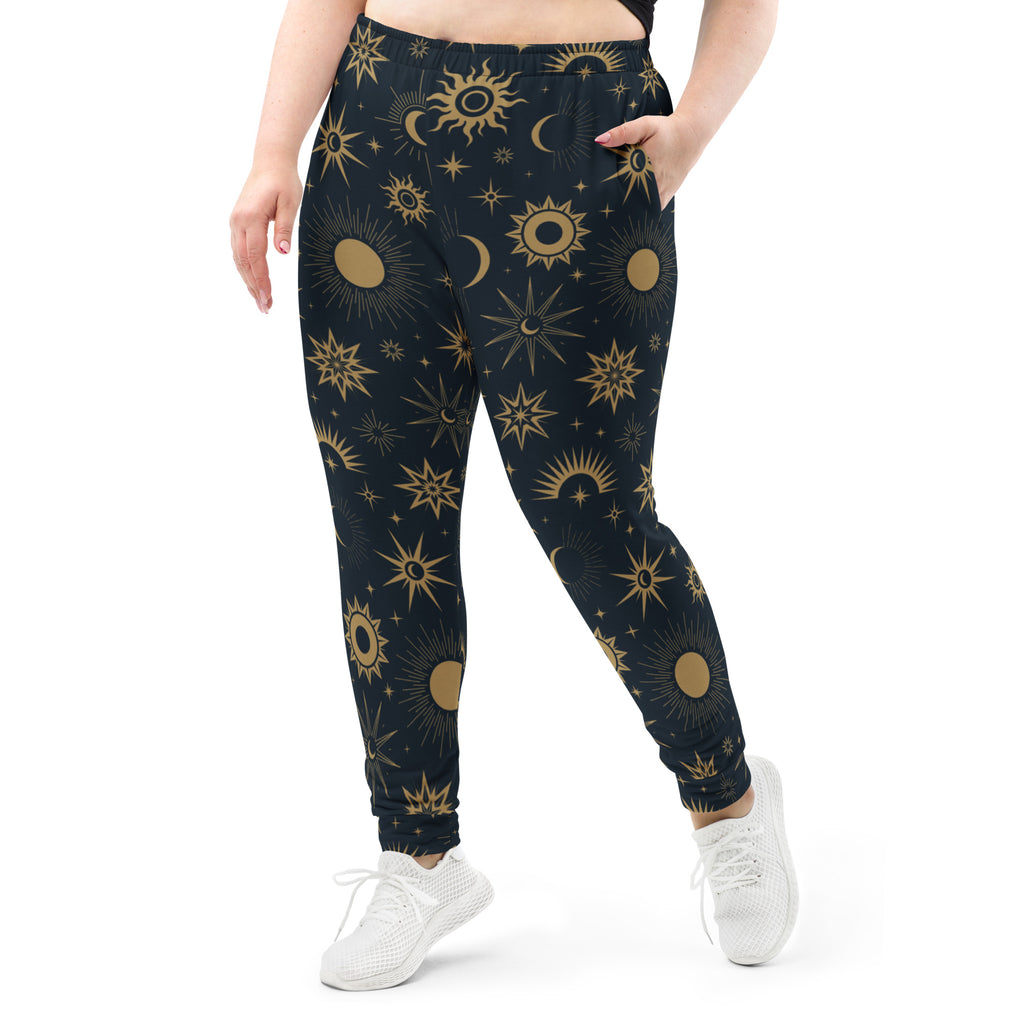 Dark blue women’s jogger pants with gold celestial sun moon star pattern cozy brushed fleece pockets
