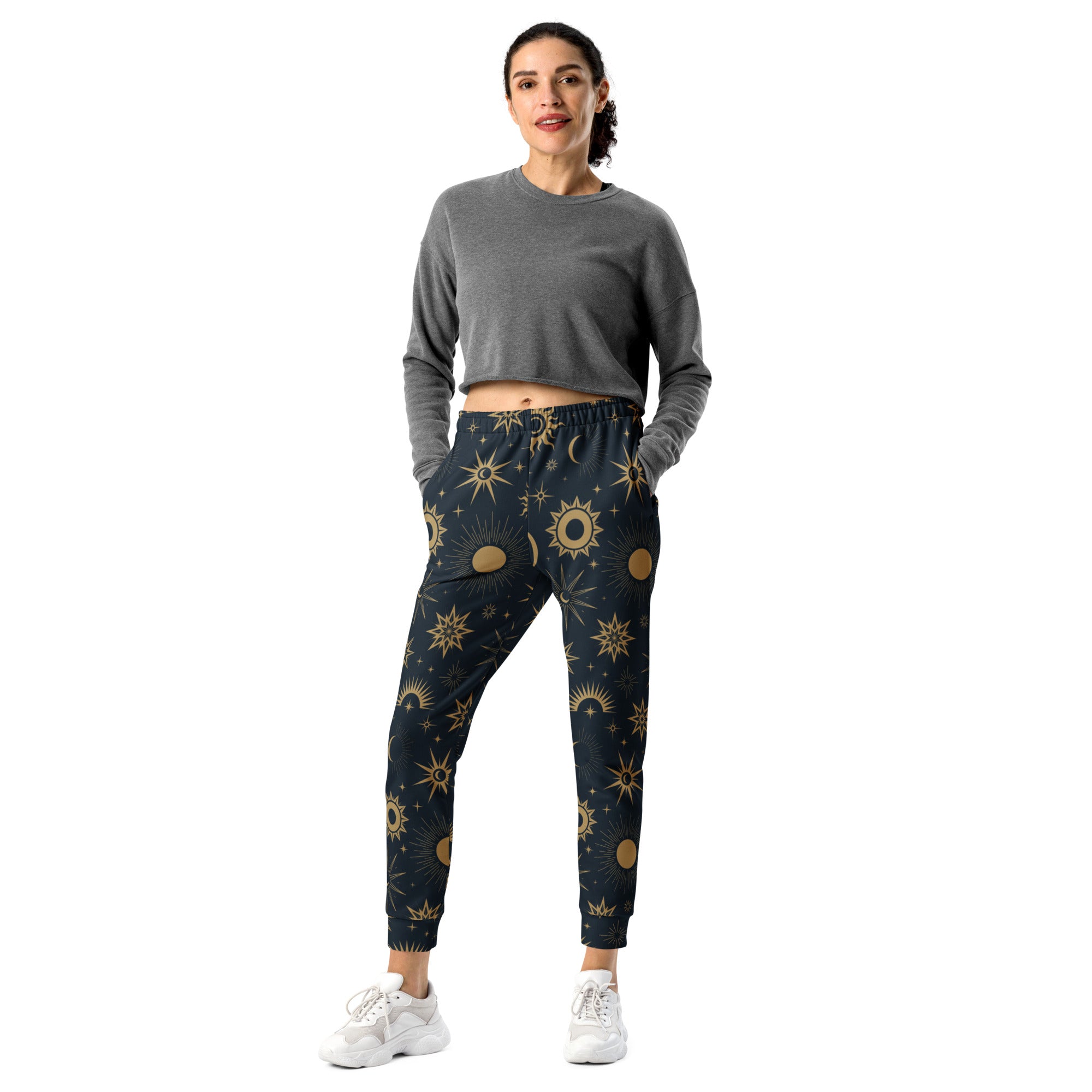 Dark blue women’s recycled jogger pants with vibrant gold celestial sun moon star pattern and cozy brushed fleece lining