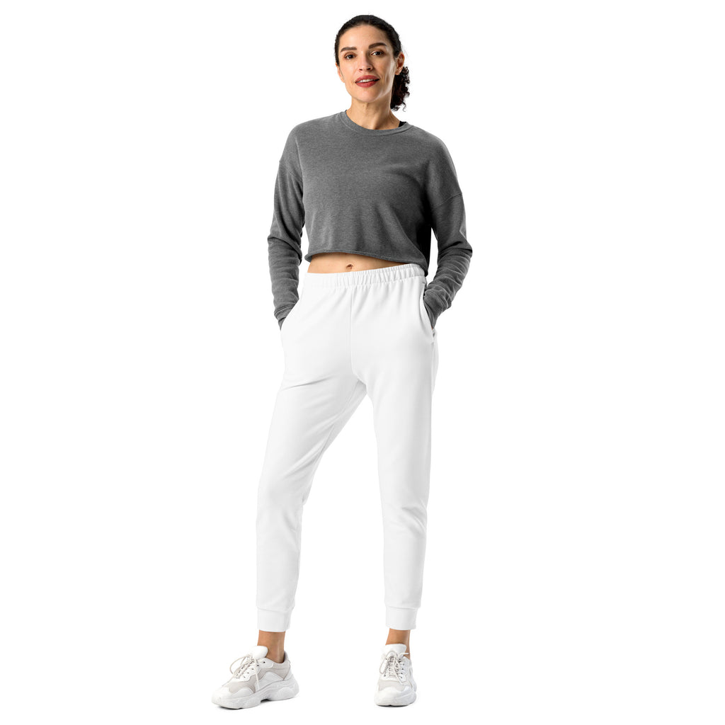 Gray long-sleeved crop top with elastic waistband and relaxed fit paired with women’s white recycled jogger pants with fleece lining