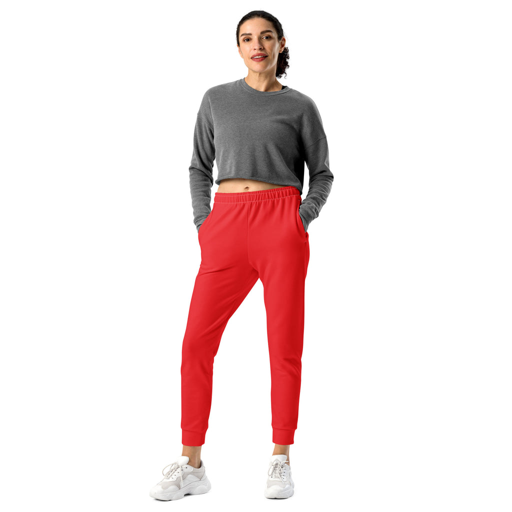 Women’s red recycled jogger pants with elastic waistband ribbed cuffs pockets and cozy brushed fleece inside