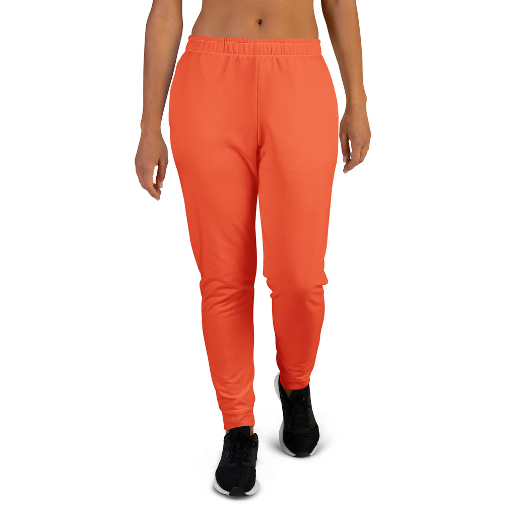 Women’s bright orange recycled jogger pants with soft stretchy fabric elastic waistband and cozy brushed fleece inside