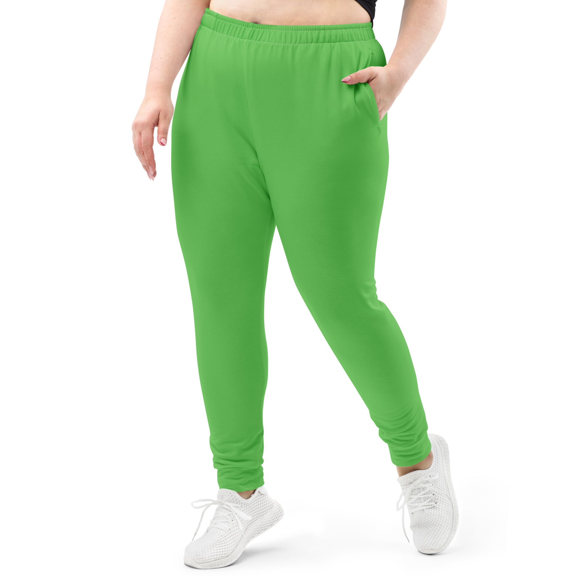 Bright green plus-size women’s recycled jogger pants with elastic waistband cuffed ankles and cozy brushed fleece lining