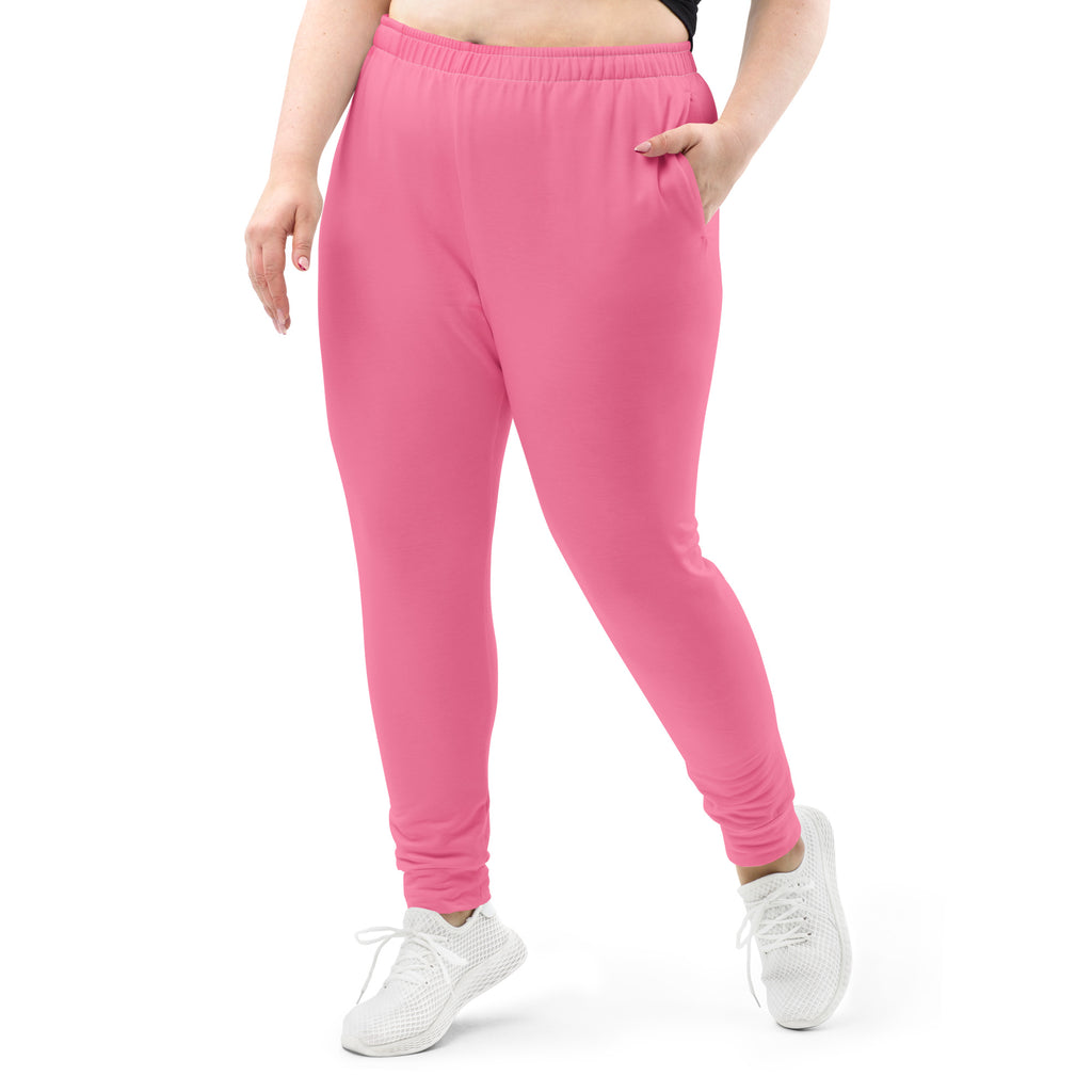 Women’s bright pink recycled jogger pants with soft brushed fleece, elastic waistband, and side pockets for comfort