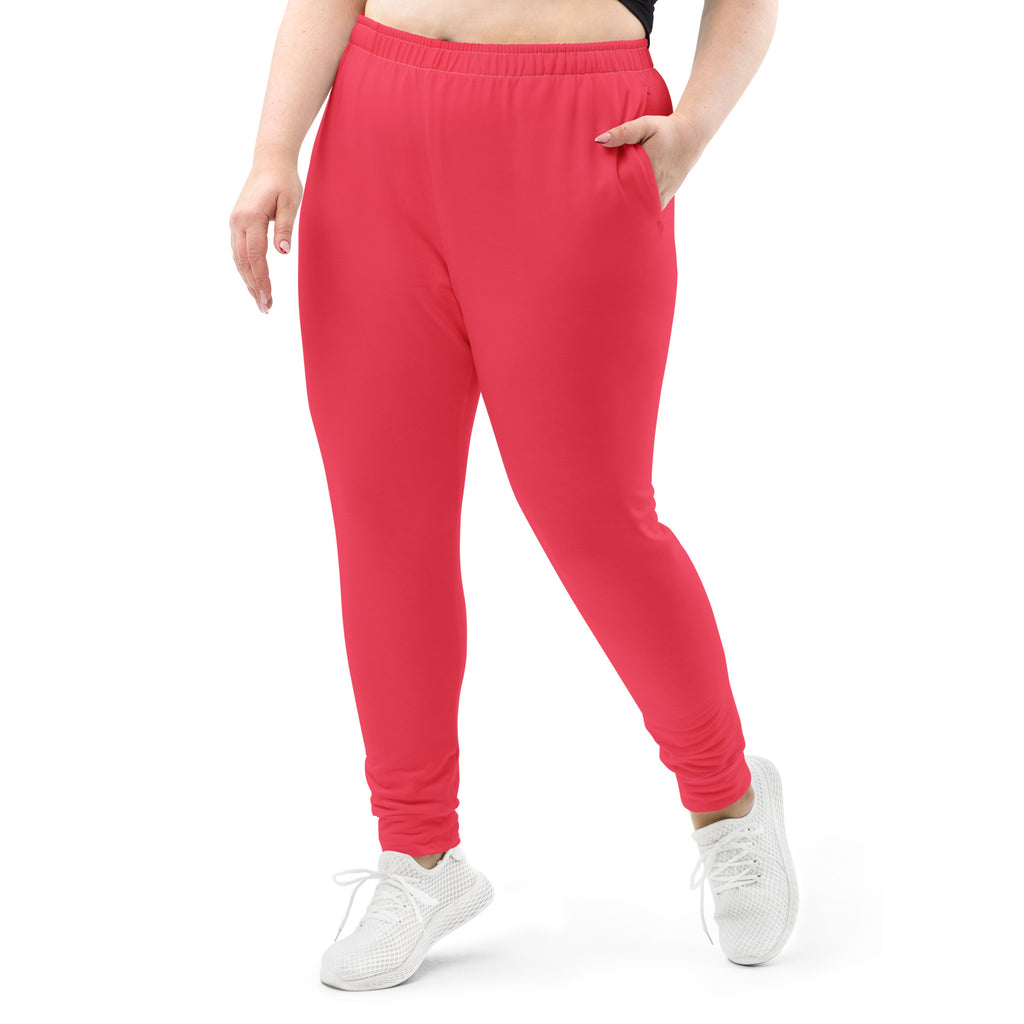 Women’s bright pink recycled jogger pants with soft fleece inside, elastic waistband, and side pockets