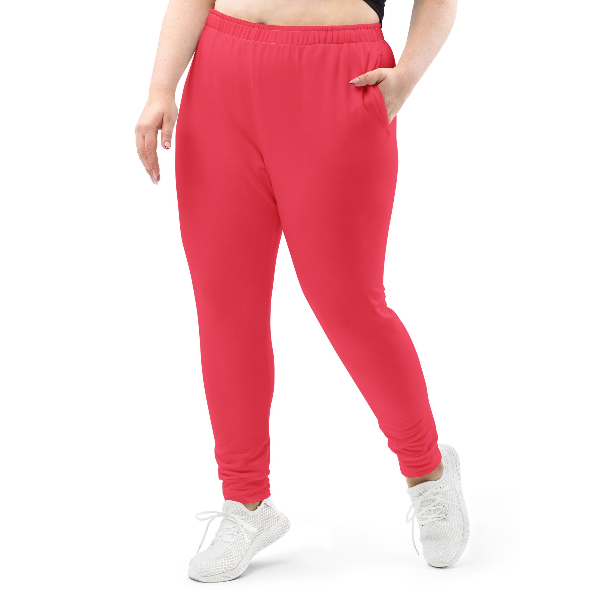 Women’s bright pink recycled jogger pants with soft fleece inside, elastic waistband, and side pockets