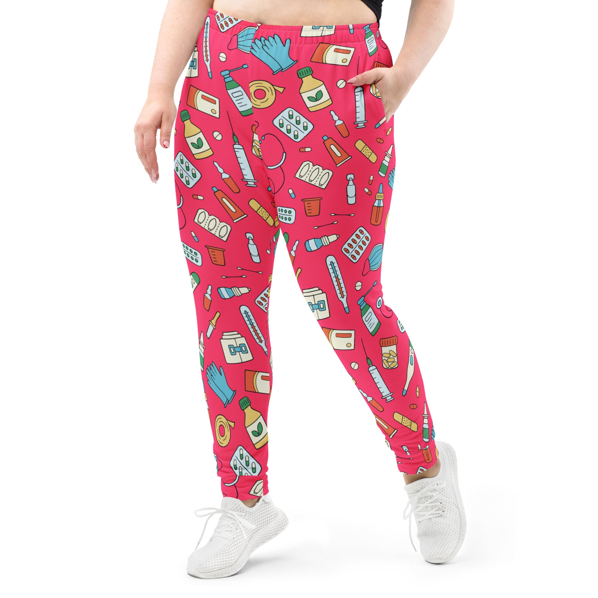 Women’s bright pink medical print recycled jogger pants with cozy brushed fleece inside and pockets featuring cartoon supplies