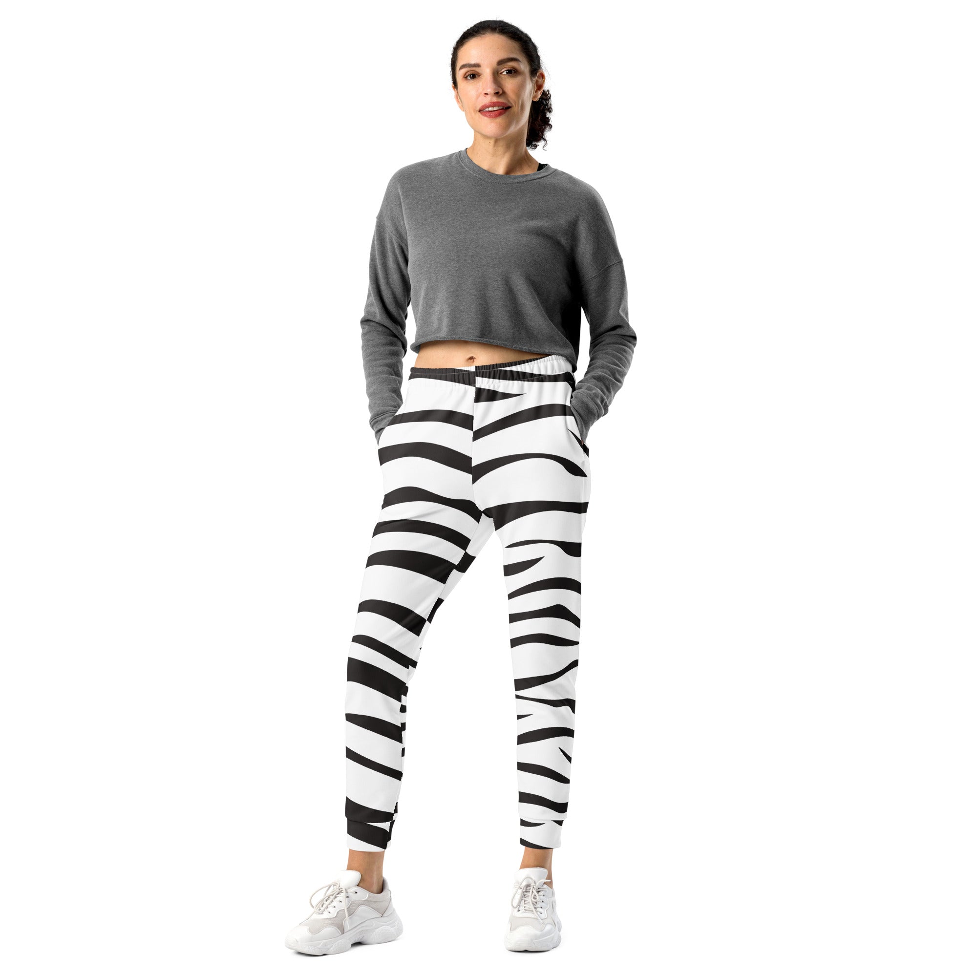 Women’s black and white zebra print jogger pants made from recycled fabric with cozy brushed inside fleece and pockets