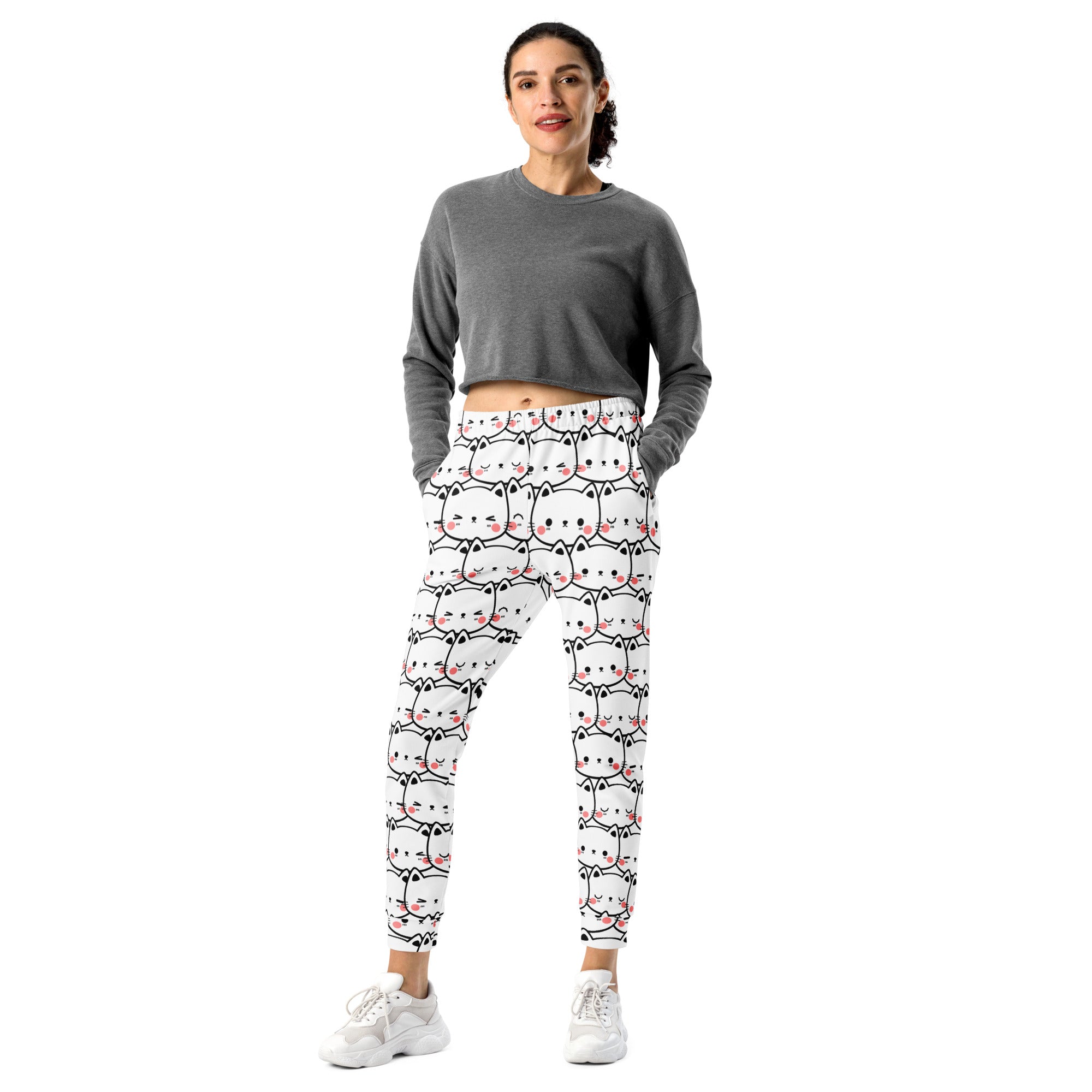 Women’s white cat print recycled jogger pants with pockets featuring black outlined cartoon cats with pink accents and cozy fleece lining