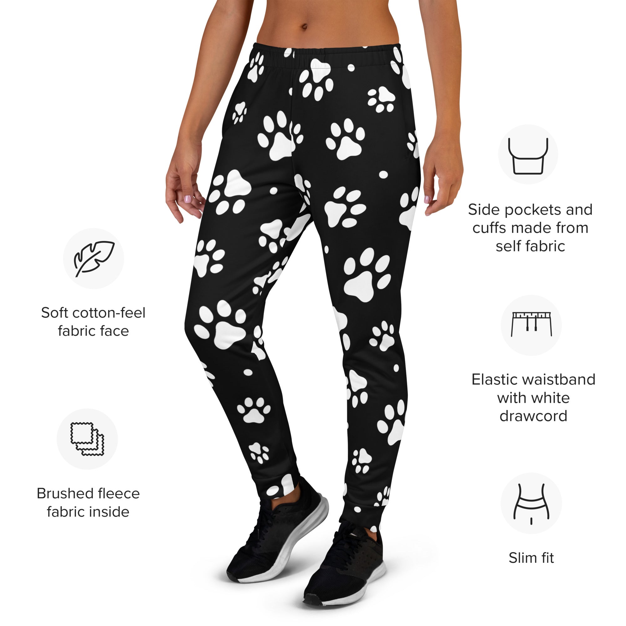 Women’s black jogger pants with white paw print pattern made from recycled soft cotton-feel fabric with cozy fleece lining