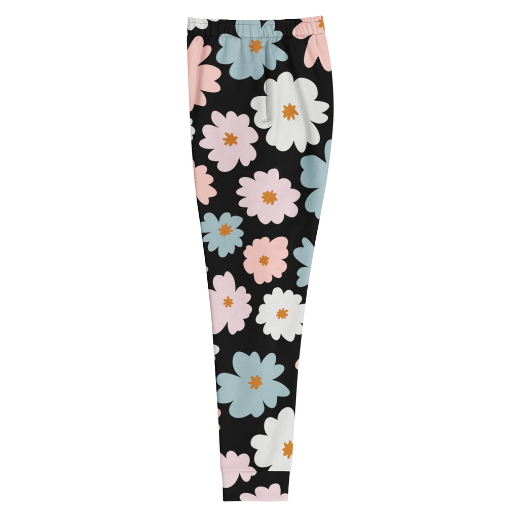 Black leggings with pastel pink light blue and white daisy pattern featuring cozy brushed fleece inside and pockets