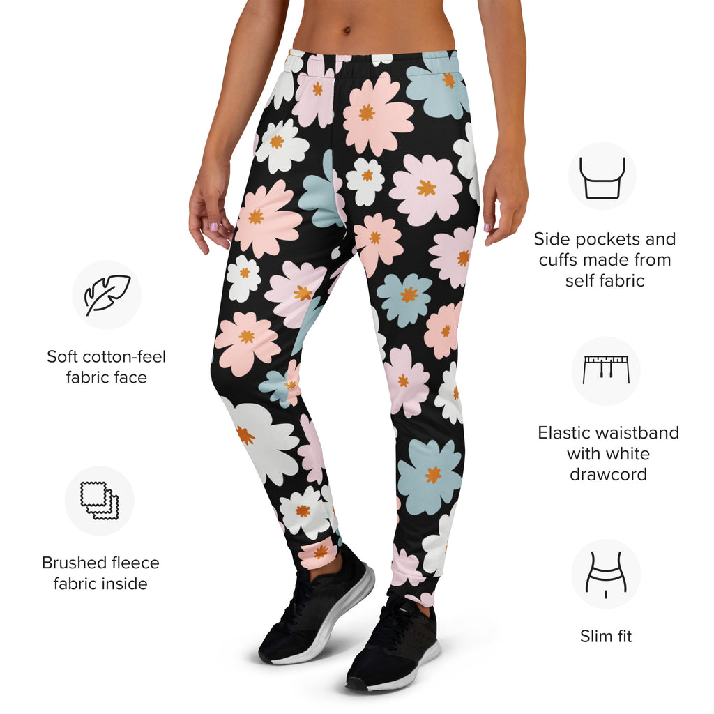 Women’s retro floral recycled jogger pants with black fabric and pink white light blue flowers on soft cotton-feel fleece