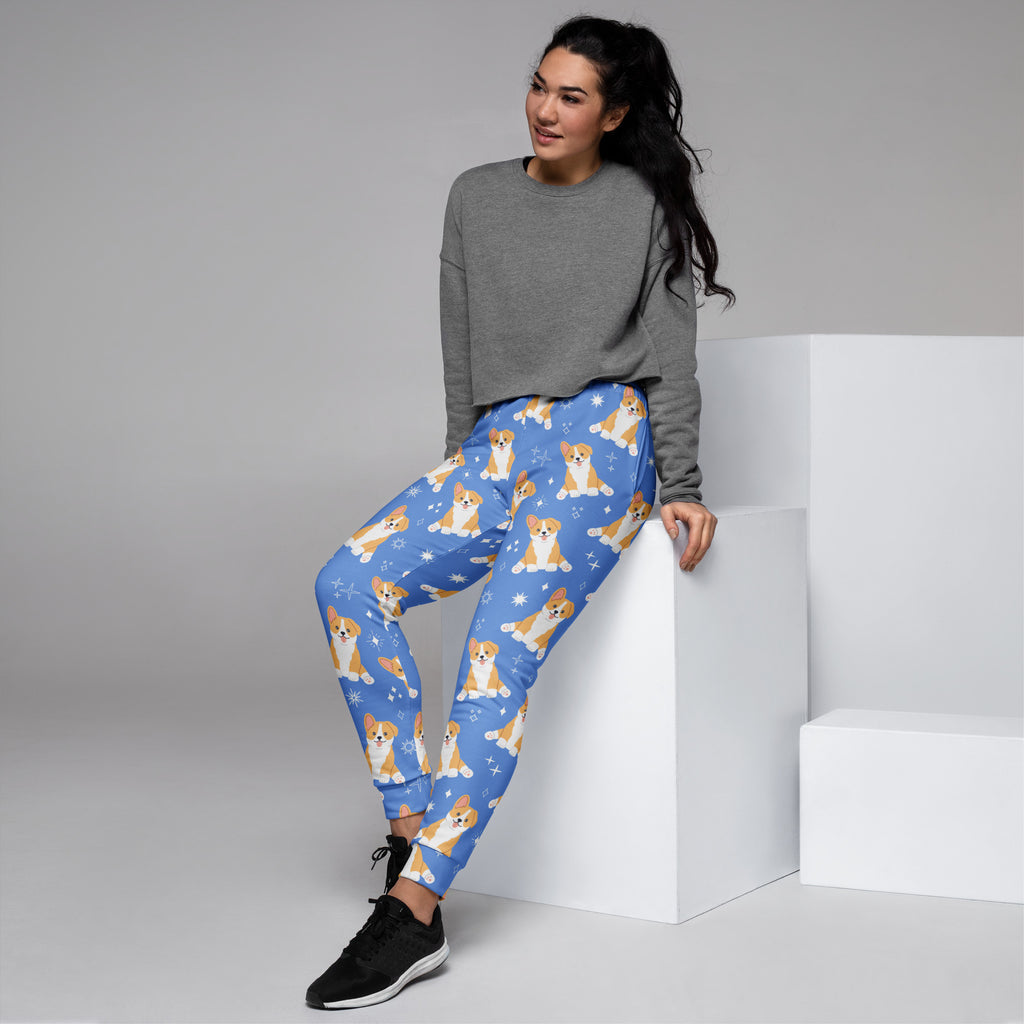 Women’s blue corgi dog recycled jogger pants with pockets featuring playful corgis and snowflakes cozy fleece lining