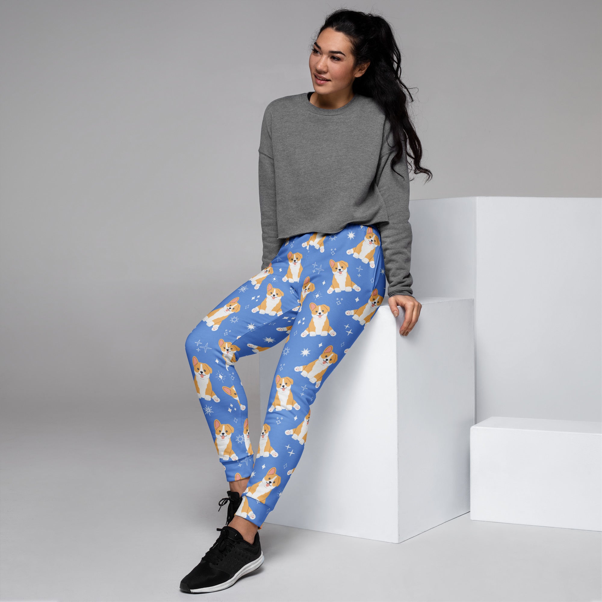 Women’s blue corgi dog recycled jogger pants with pockets featuring playful corgis and snowflakes cozy fleece lining