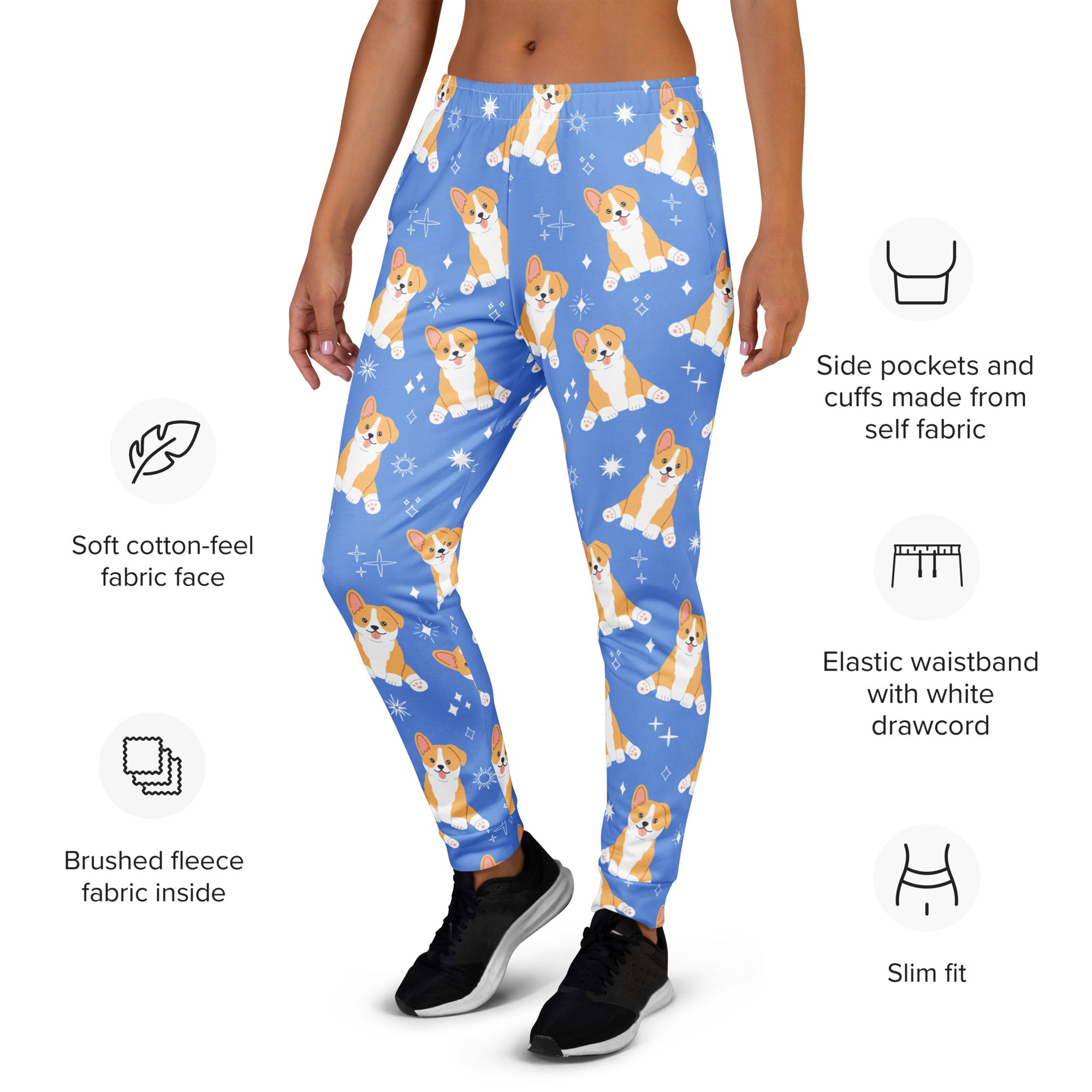Women’s blue recycled jogger pants with orange and white corgi dog pattern and star accents featuring cozy brushed fleece