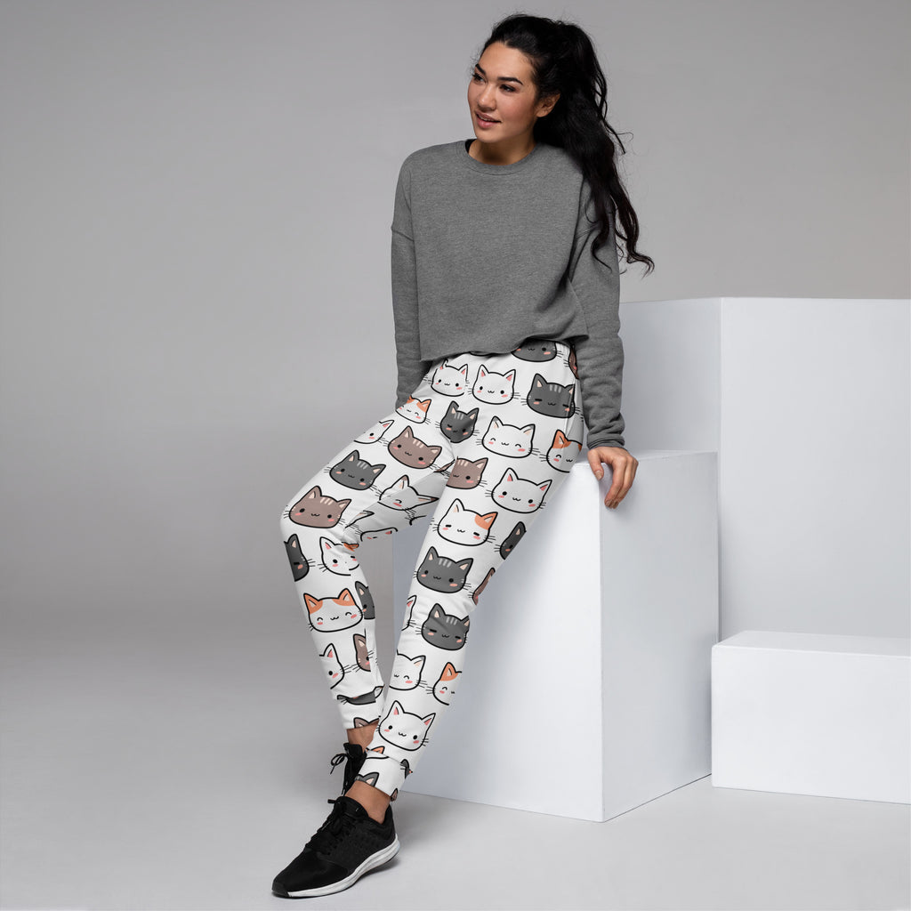 White women’s cat recycled jogger pants with pockets featuring colorful cartoon cats and cozy brushed fleece inside