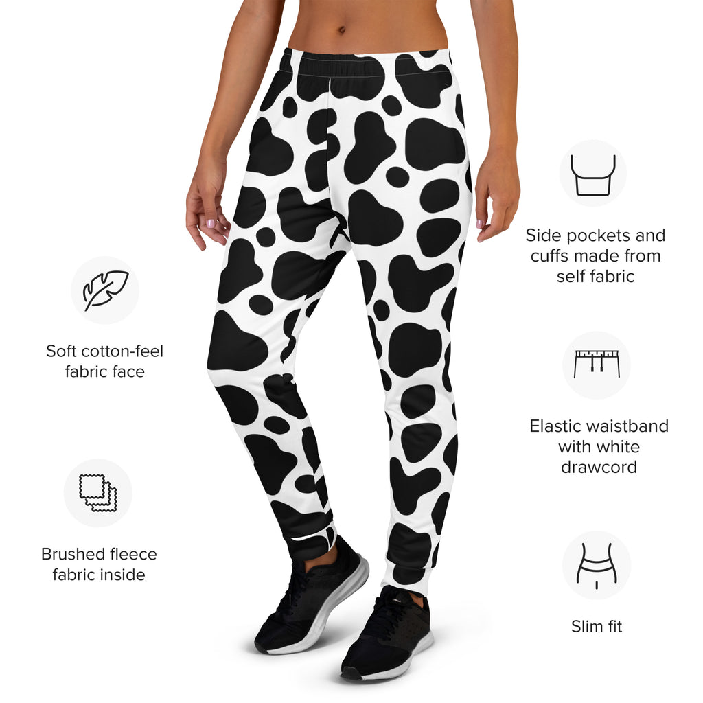 Women’s black and white cow print recycled jogger pants with soft cotton feel and cozy brushed fleece lining with pockets