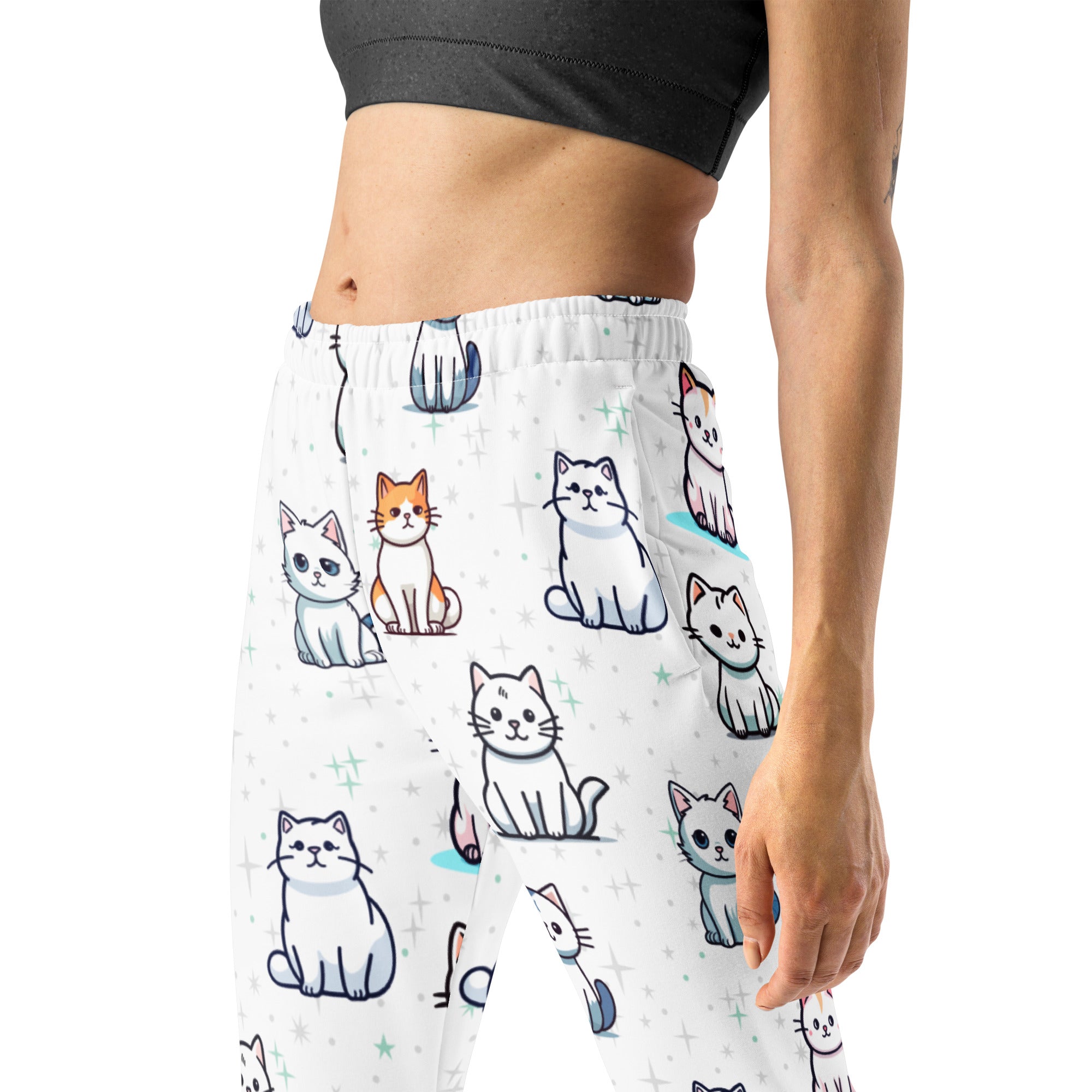 White women’s jogger pants with colorful cartoon cats, cozy brushed fleece inside, pockets, made from recycled fabric