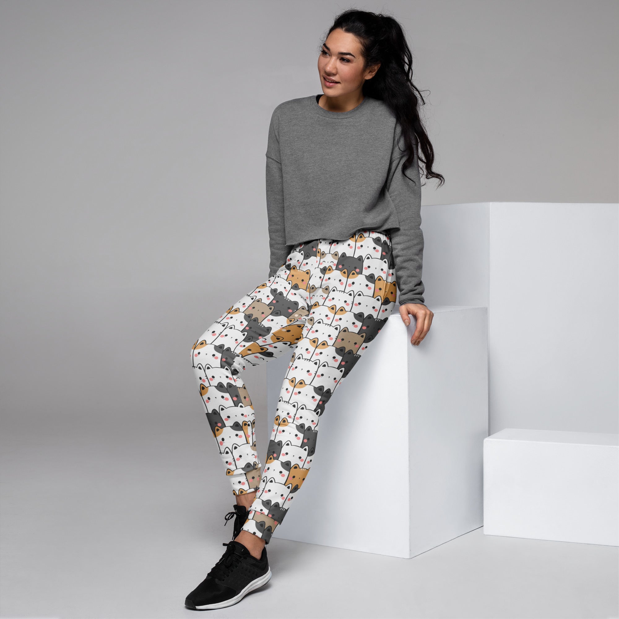 White womens kawaii cat recycled jogger pants with cozy fleece inside and colorful cartoon cat pattern
