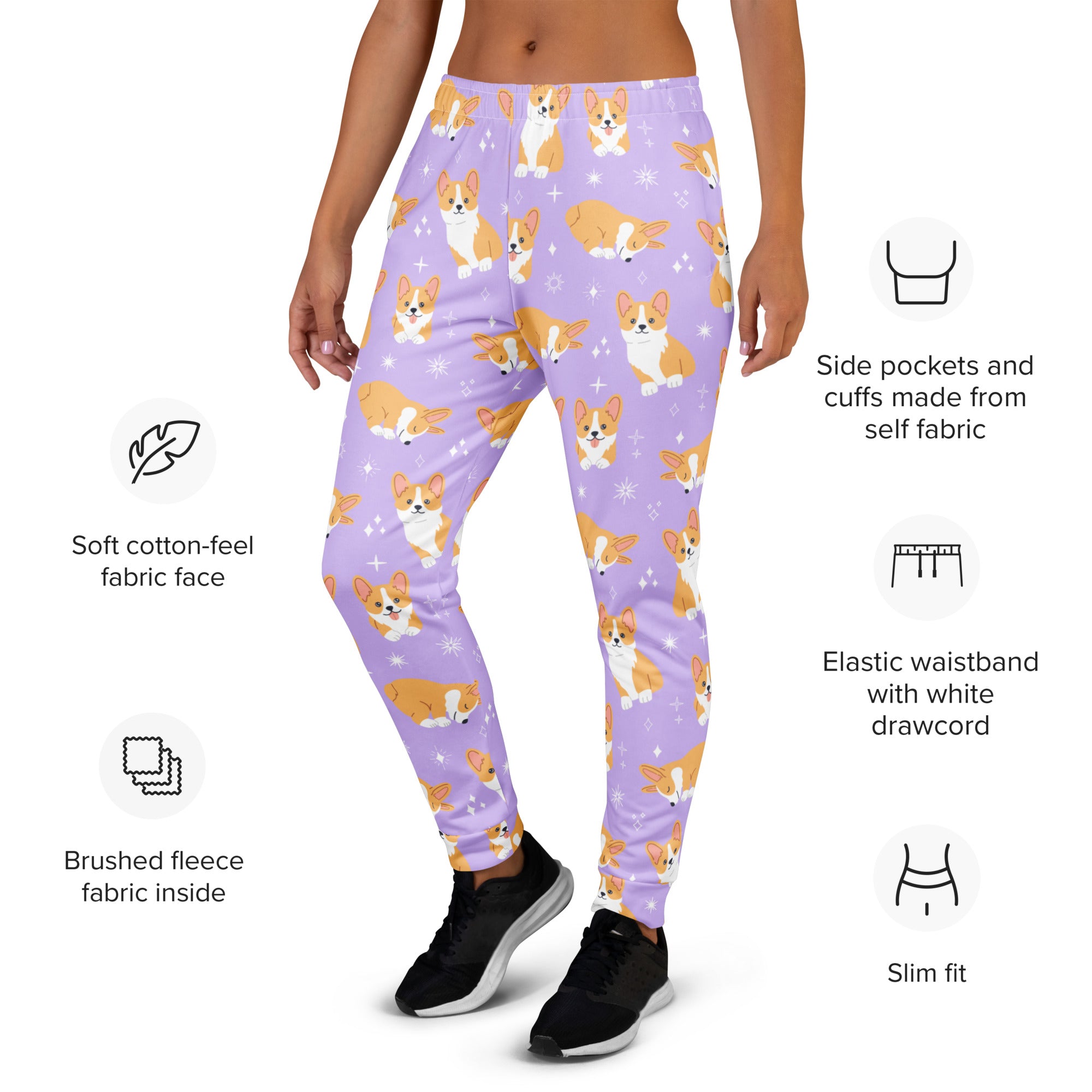 Women’s purple recycled jogger pants with pockets featuring orange and white corgi dogs and sparkling star accents