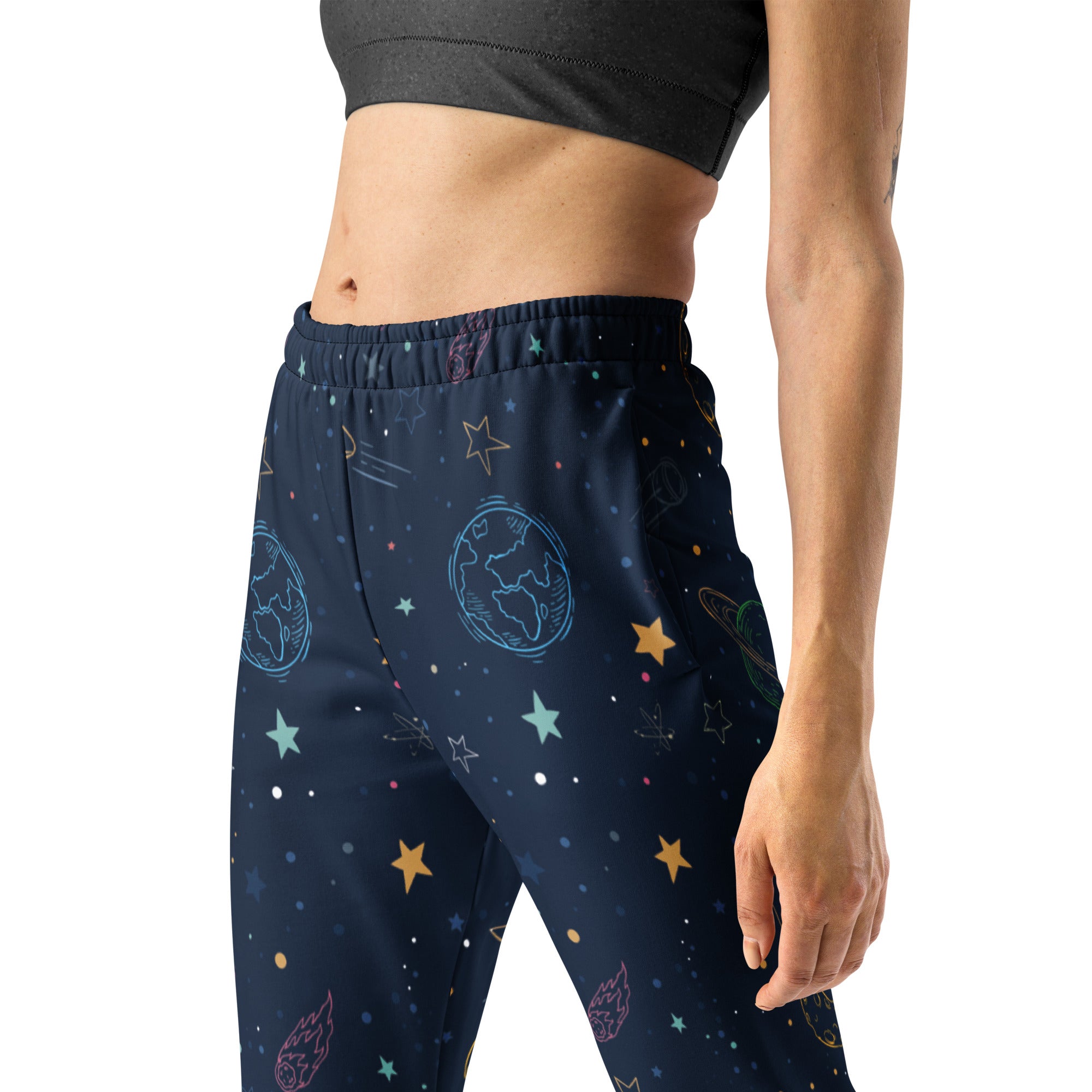 Women’s dark blue space-themed recycled jogger pants with colorful celestial prints and cozy brushed fleece lining