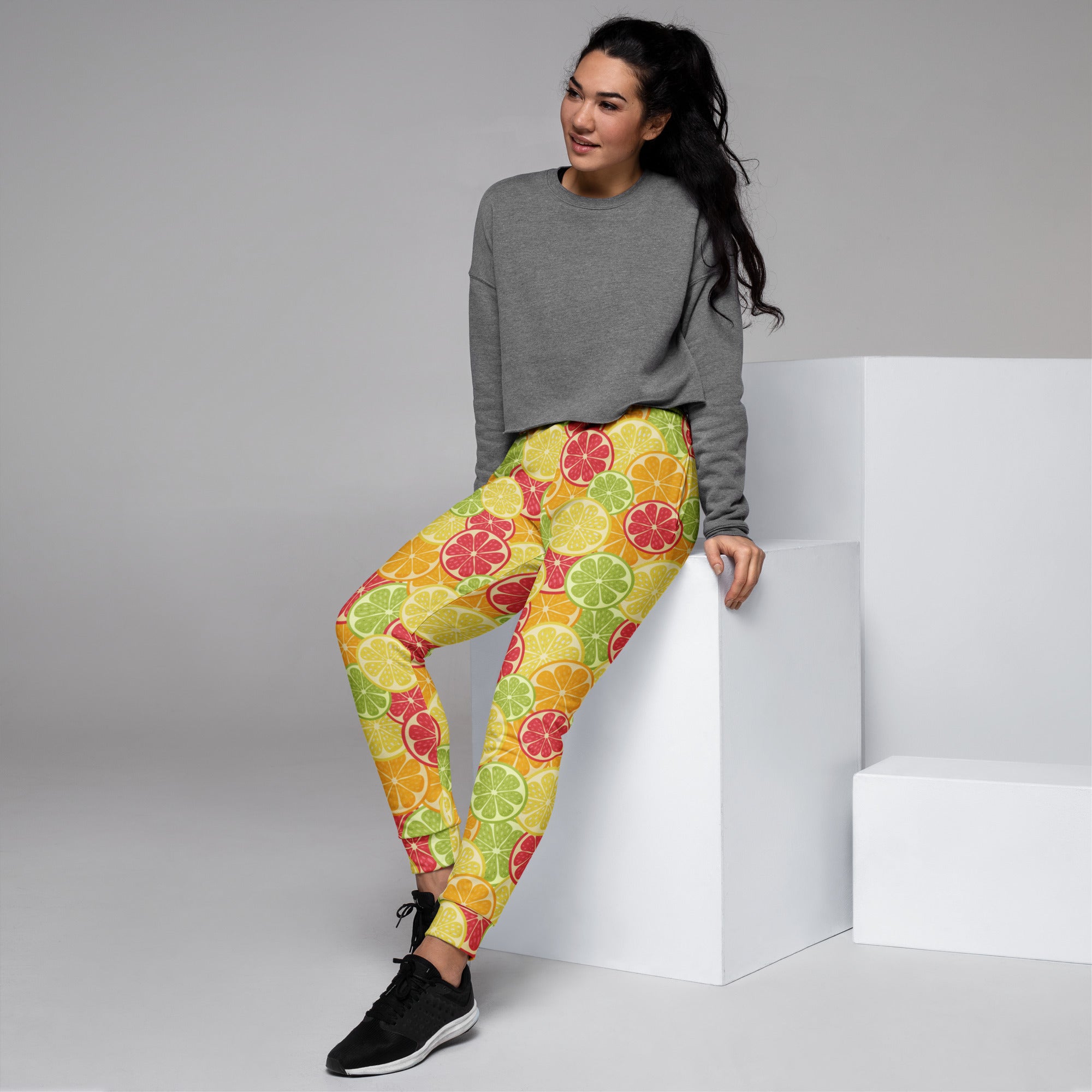 Women’s citrus slice recycled jogger pants with pockets in yellow green and red featuring cozy brushed fleece inside