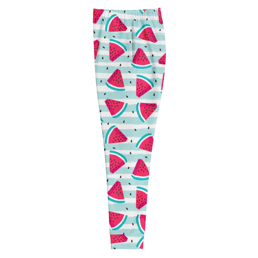 Women’s striped watermelon recycled jogger pants with pockets in mint green and pink featuring black seeds on striped background