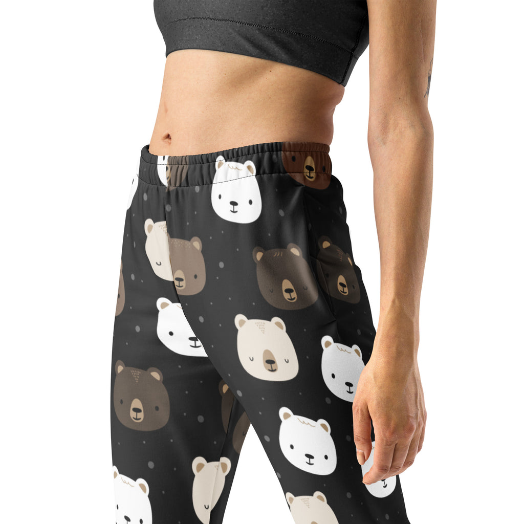 Women’s black leggings with a playful white and brown bear face pattern made from cozy recycled fleece with pockets