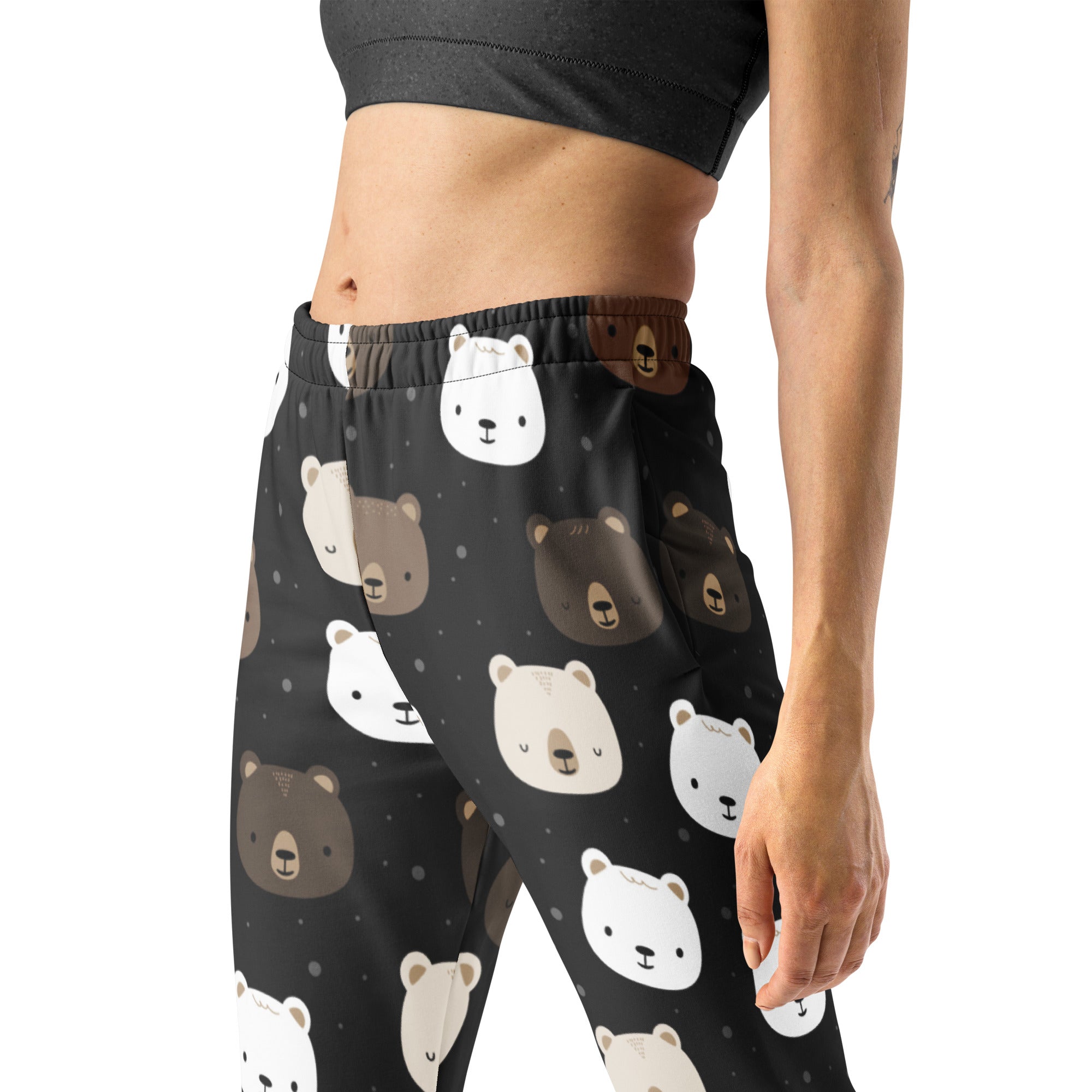 Women’s black leggings with a playful white and brown bear face pattern made from cozy recycled fleece with pockets