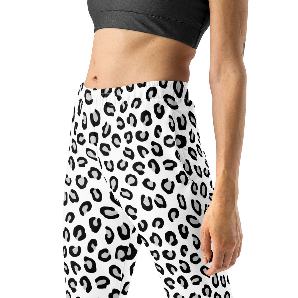 White leggings with bold black leopard print made from recycled fabric featuring cozy brushed fleece inside