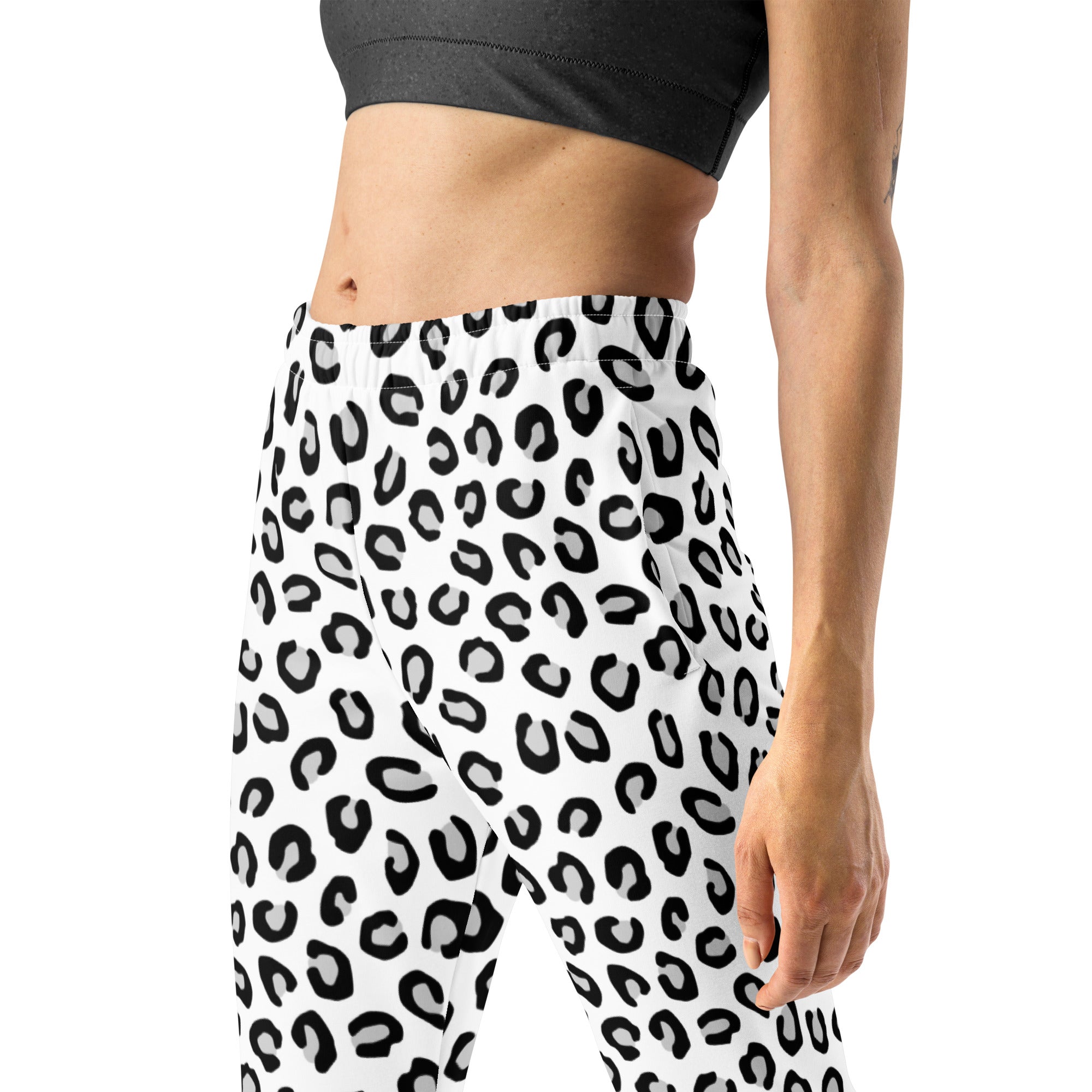 White leggings with bold black leopard print made from recycled fabric featuring cozy brushed fleece inside