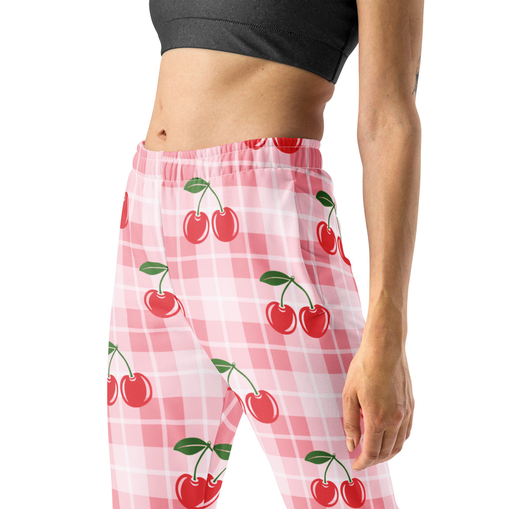 Women’s pink cherry plaid recycled jogger pants with pockets featuring pink and white checkered leggings with cherry print