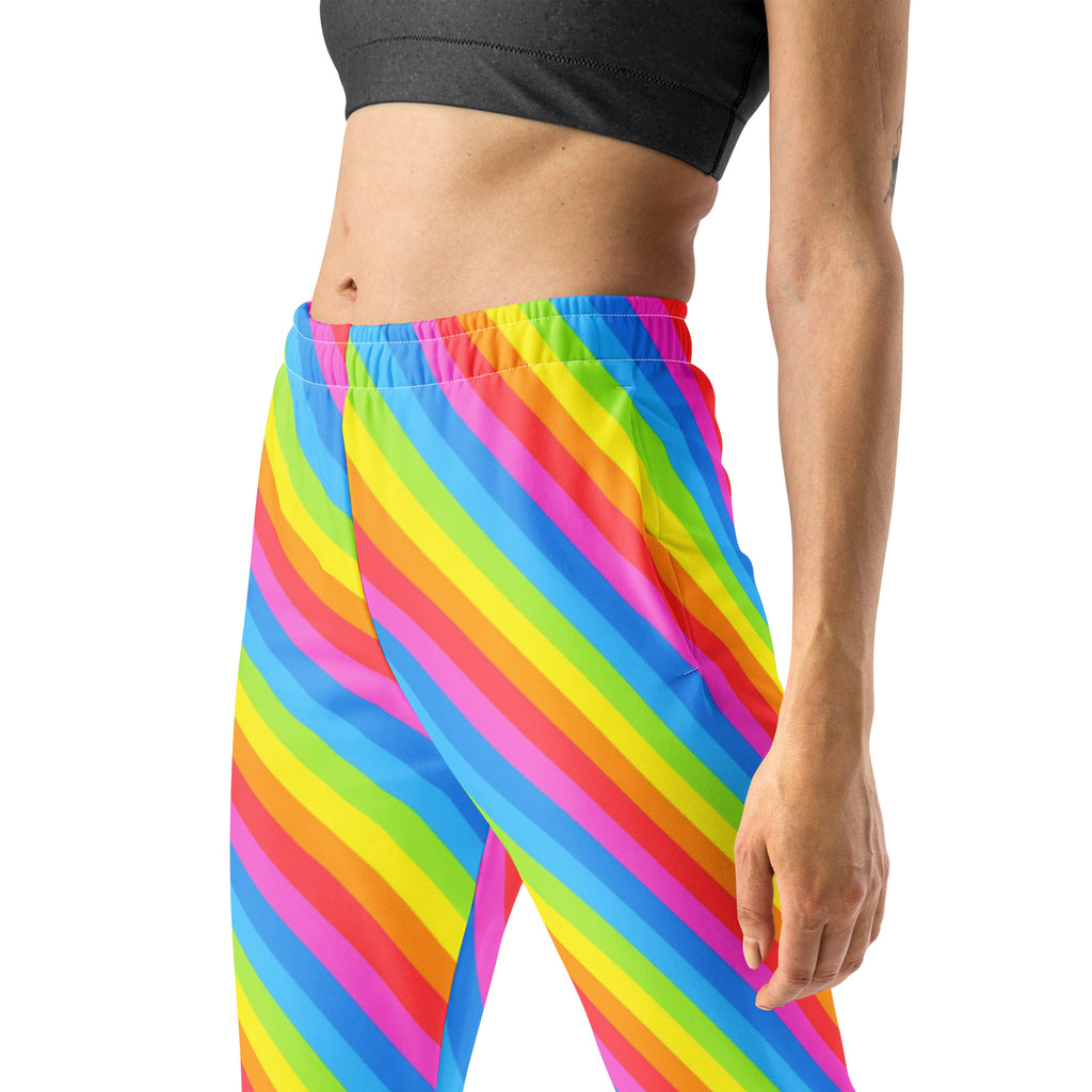 Women’s rainbow stripe recycled jogger pants with vibrant pink yellow blue green diagonal stripes and cozy brushed fleece interior
