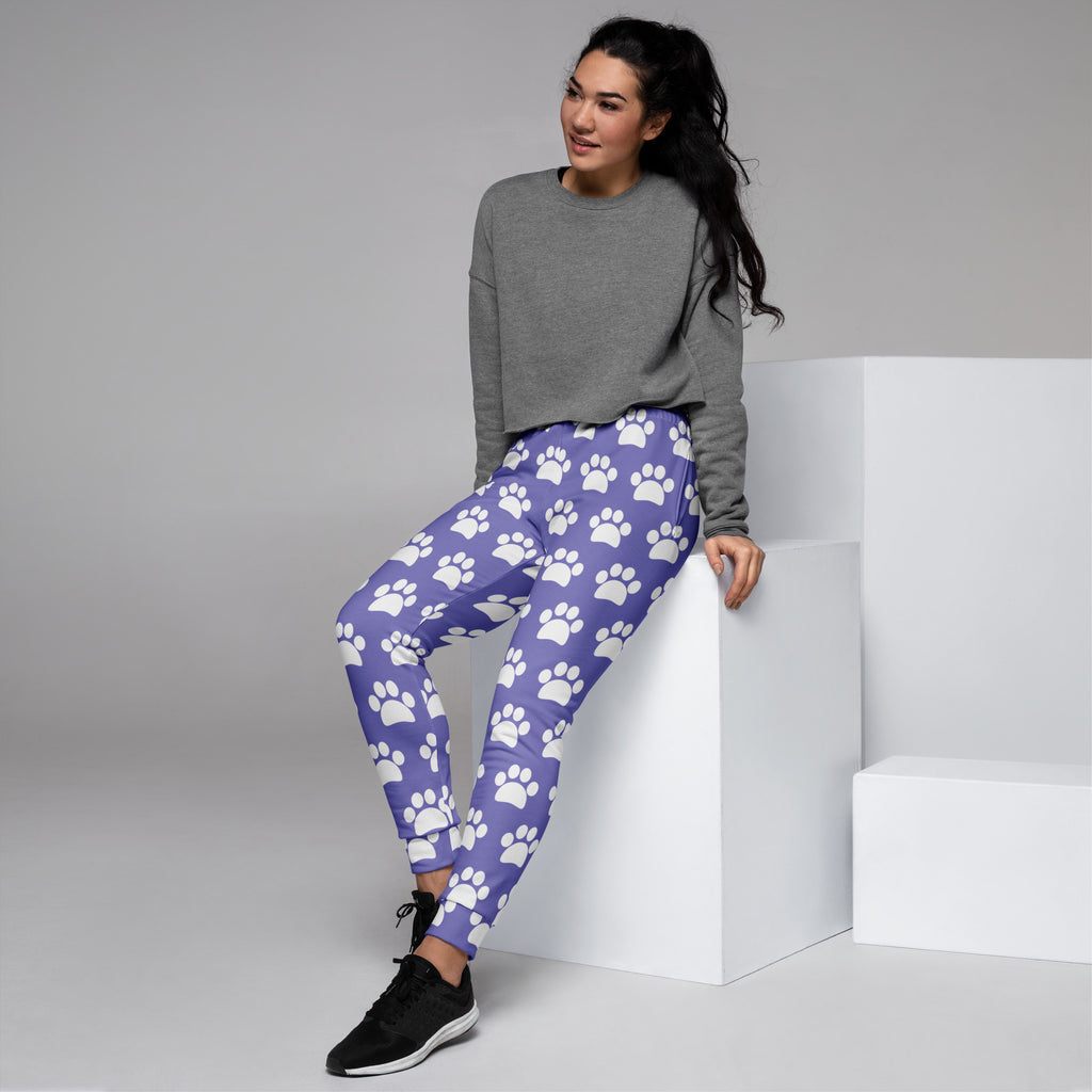 Women’s purple paw print recycled jogger pants with cozy brushed fleece inside and white paw print pattern