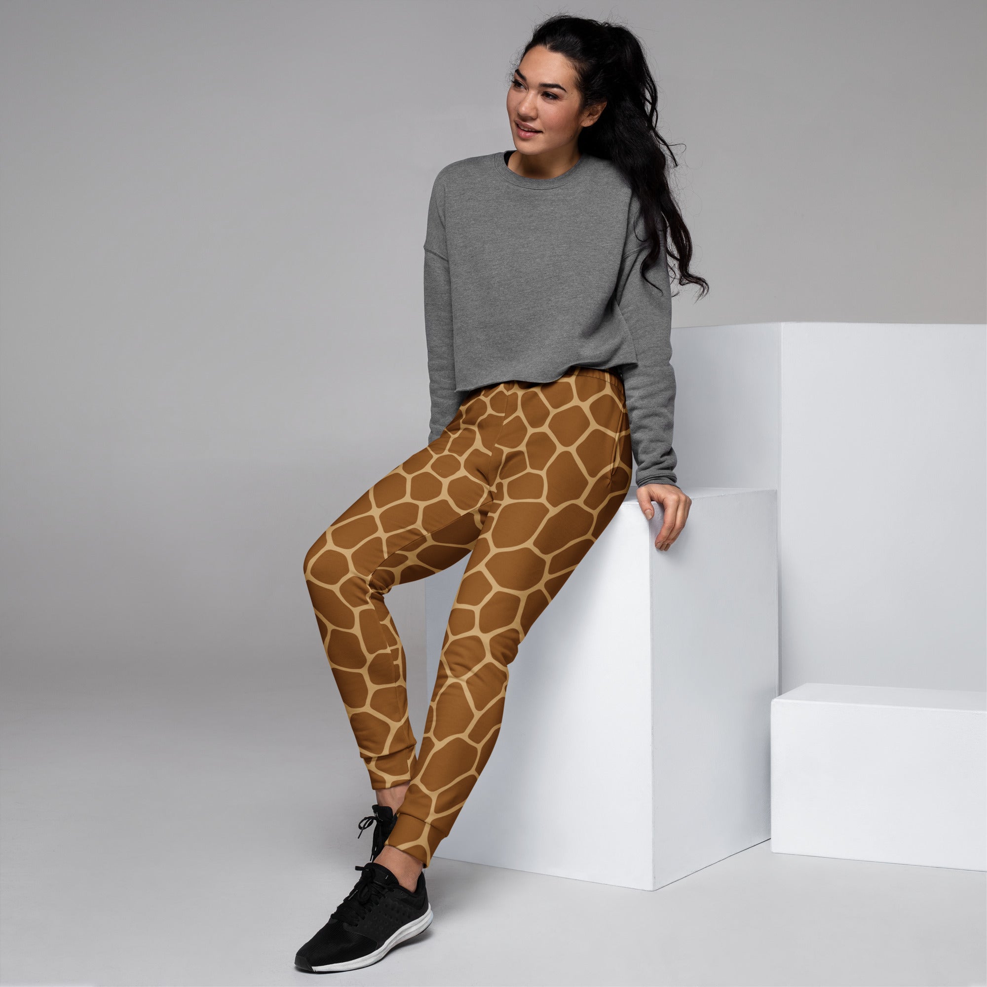 Women’s brown giraffe print recycled jogger pants with pockets and cozy brushed inside fleece lining