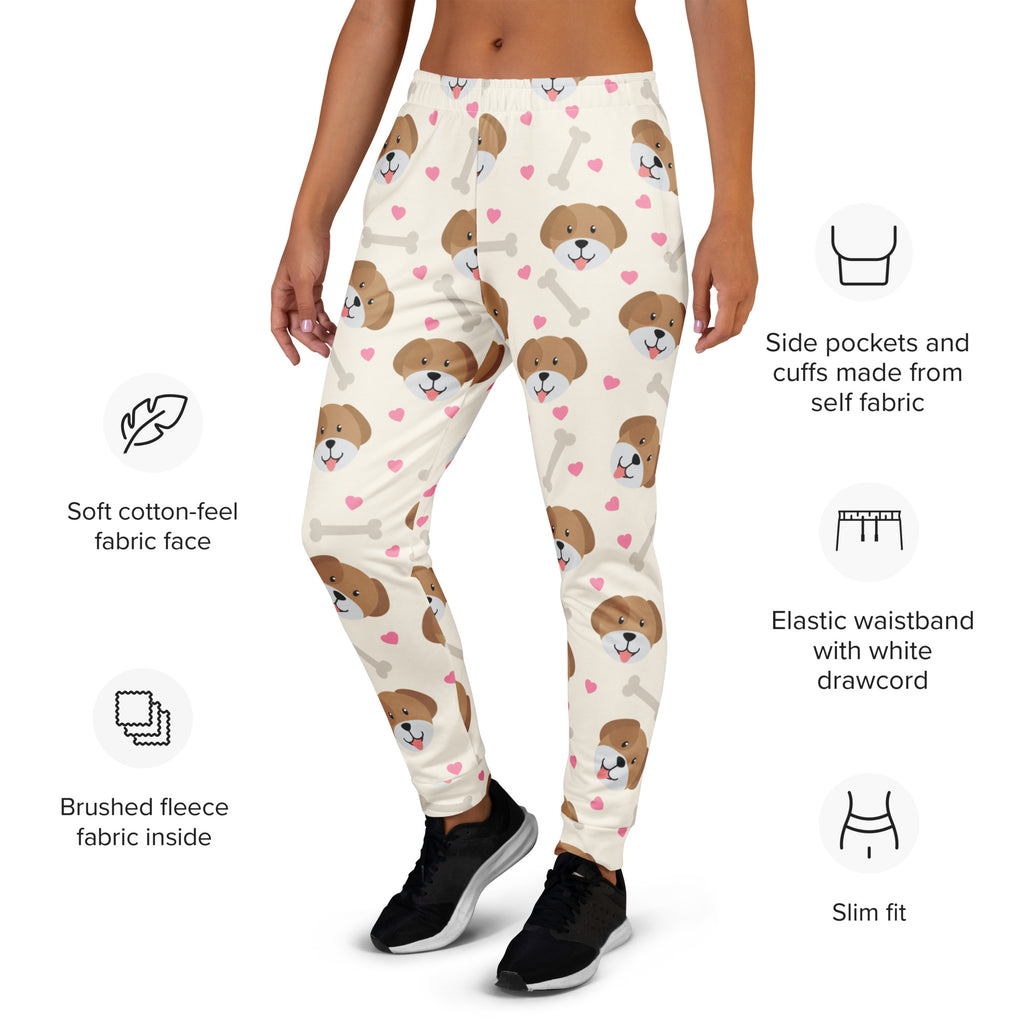 Cream-colored women’s jogger pants with brown puppy faces pink hearts white bones print recycled breathable fleece lining