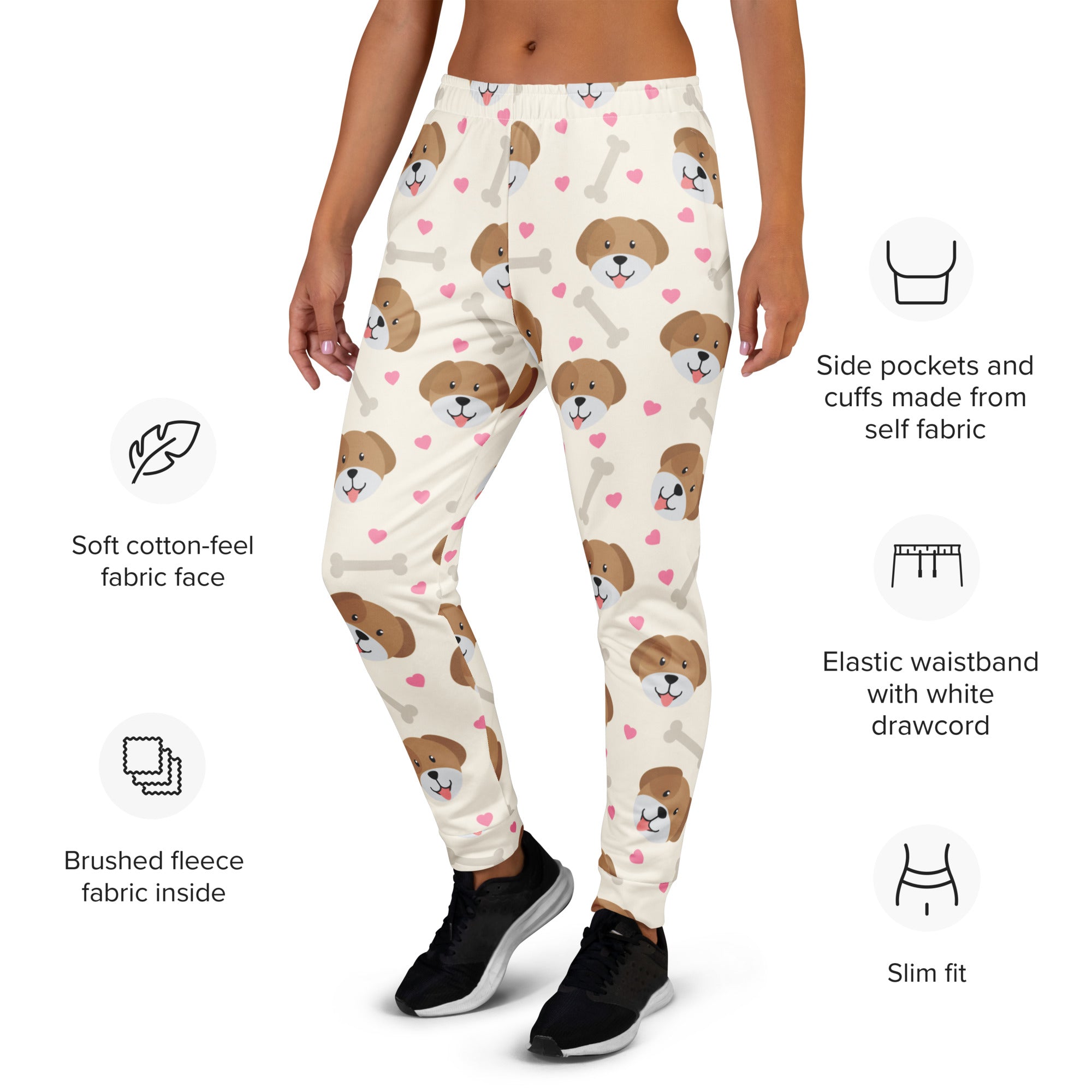 Cream-colored women’s jogger pants with brown puppy faces pink hearts white bones print recycled breathable fleece lining
