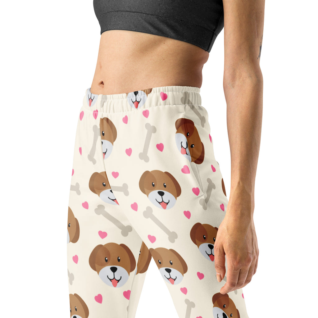 Cream-colored women’s jogger pants with brown puppy faces pink hearts and gray bones cozy brushed inside fleece